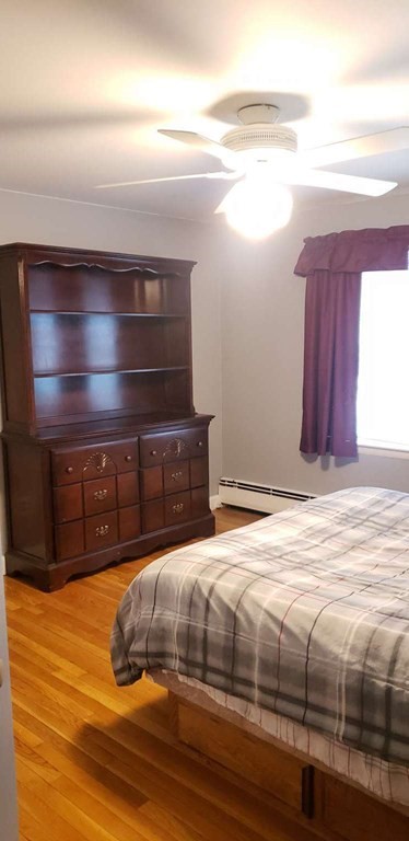 18 Davis Street Woburn, MA 01801 - Photo 8 of 20 a bedroom with a bed and a window