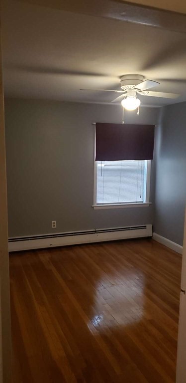18 Davis Street Woburn, MA 01801 - Photo 10 of 20 a view of room with wooden floor and window