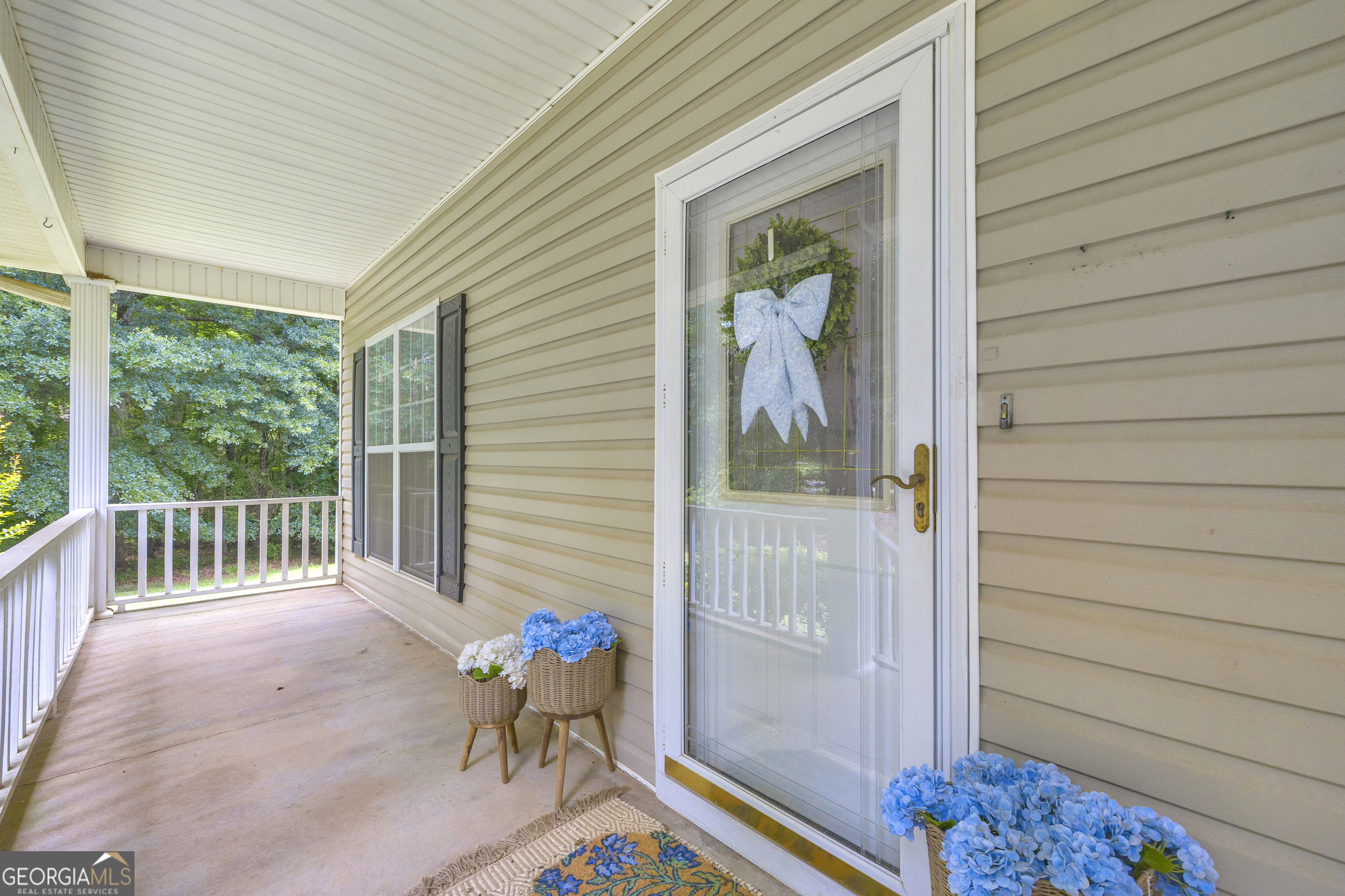 163 Tuxedo Drive Commerce, GA 30530 - Photo 10 of 62 a view of a porch with furniture