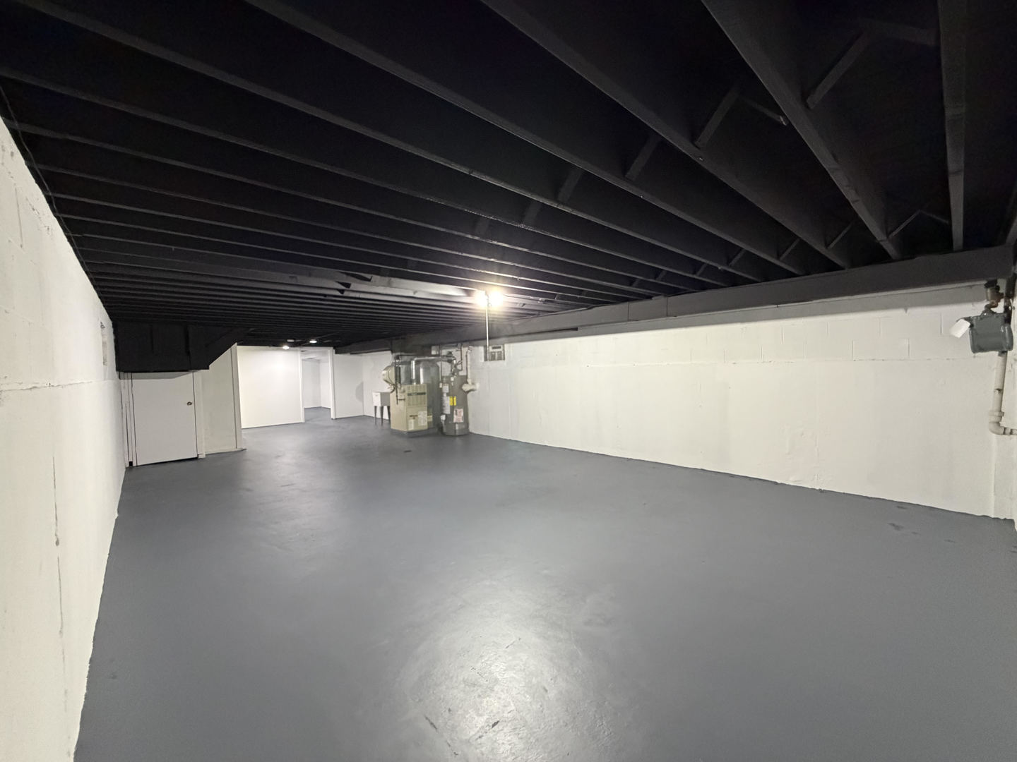 9534 South Yale Avenue Chicago, IL 60628 - Photo 19 of 26 a view of water heater room with wooden floor