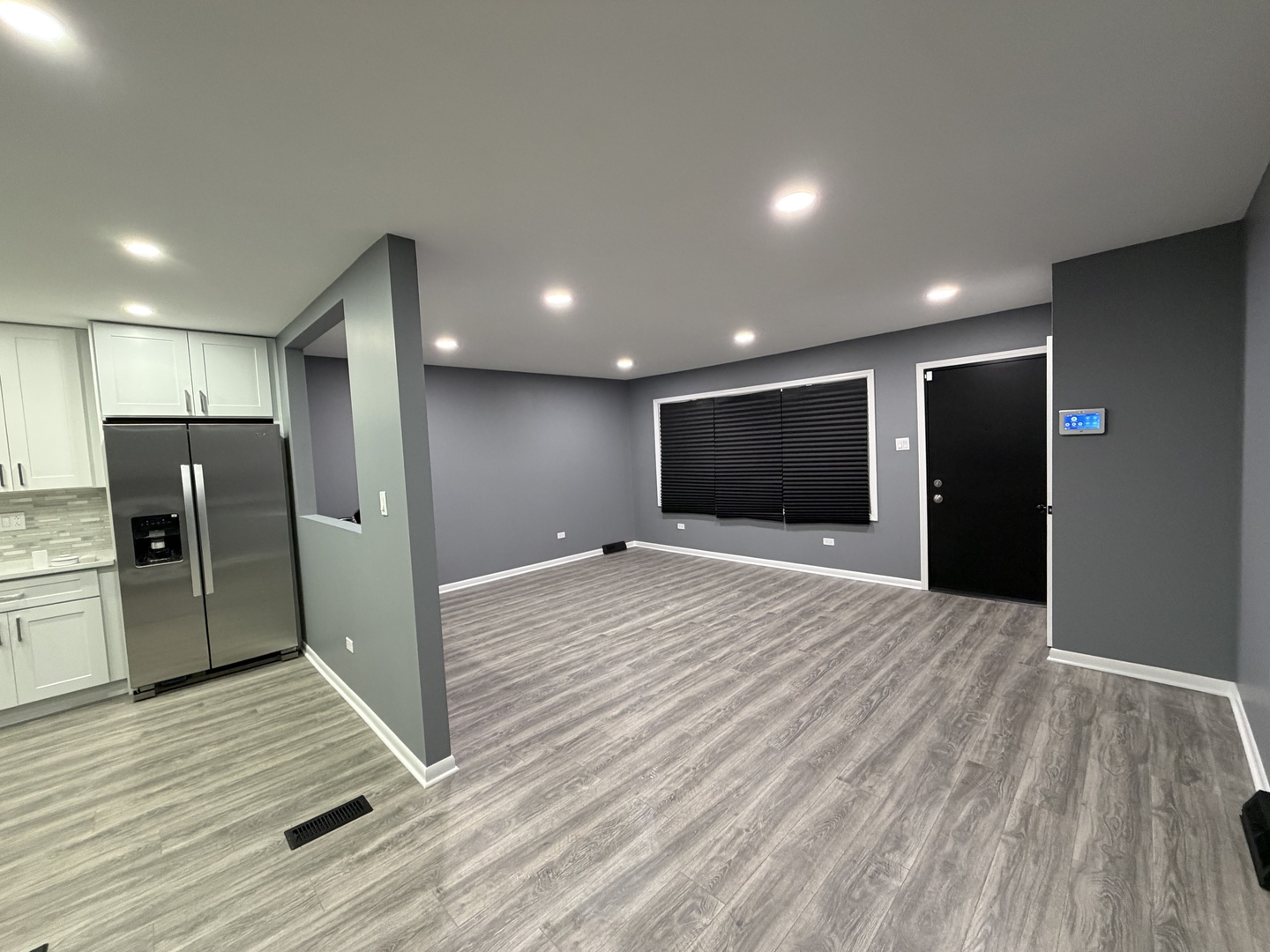 9534 South Yale Avenue Chicago, IL 60628 - Photo 6 of 26 a view of a livingroom with a hall and wooden floor