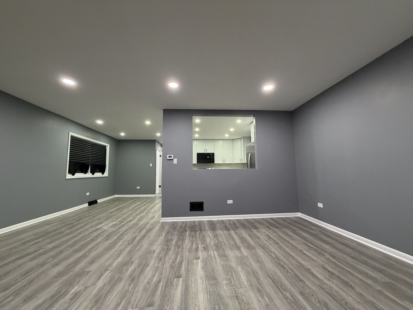 9534 South Yale Avenue Chicago, IL 60628 - Photo 7 of 26 a view of a livingroom with an empty space and a window
