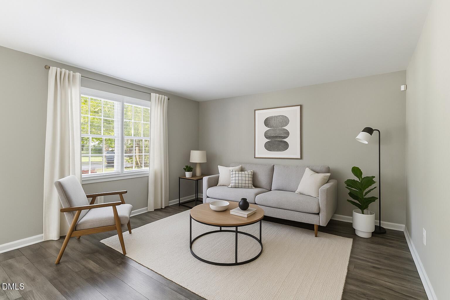 2400 Keith Drive Raleigh, NC 27610 - Photo 10 of 35 a living room with furniture a window and a potted plant