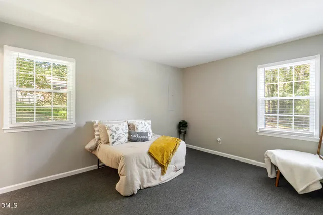 a room with a bed and a window