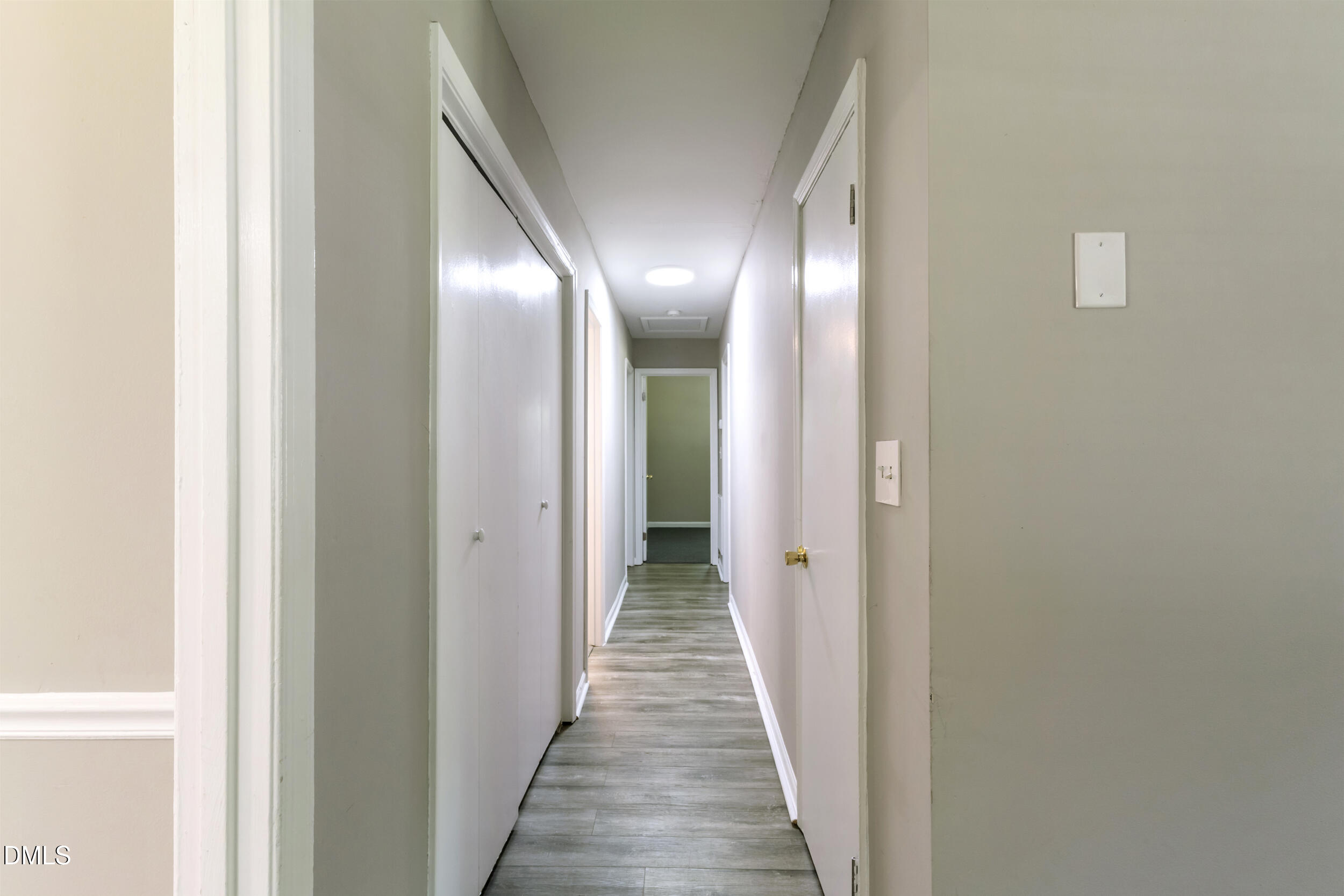 2400 Keith Drive Raleigh, NC 27610 - Photo 25 of 35 a view of a hallway with wooden floor