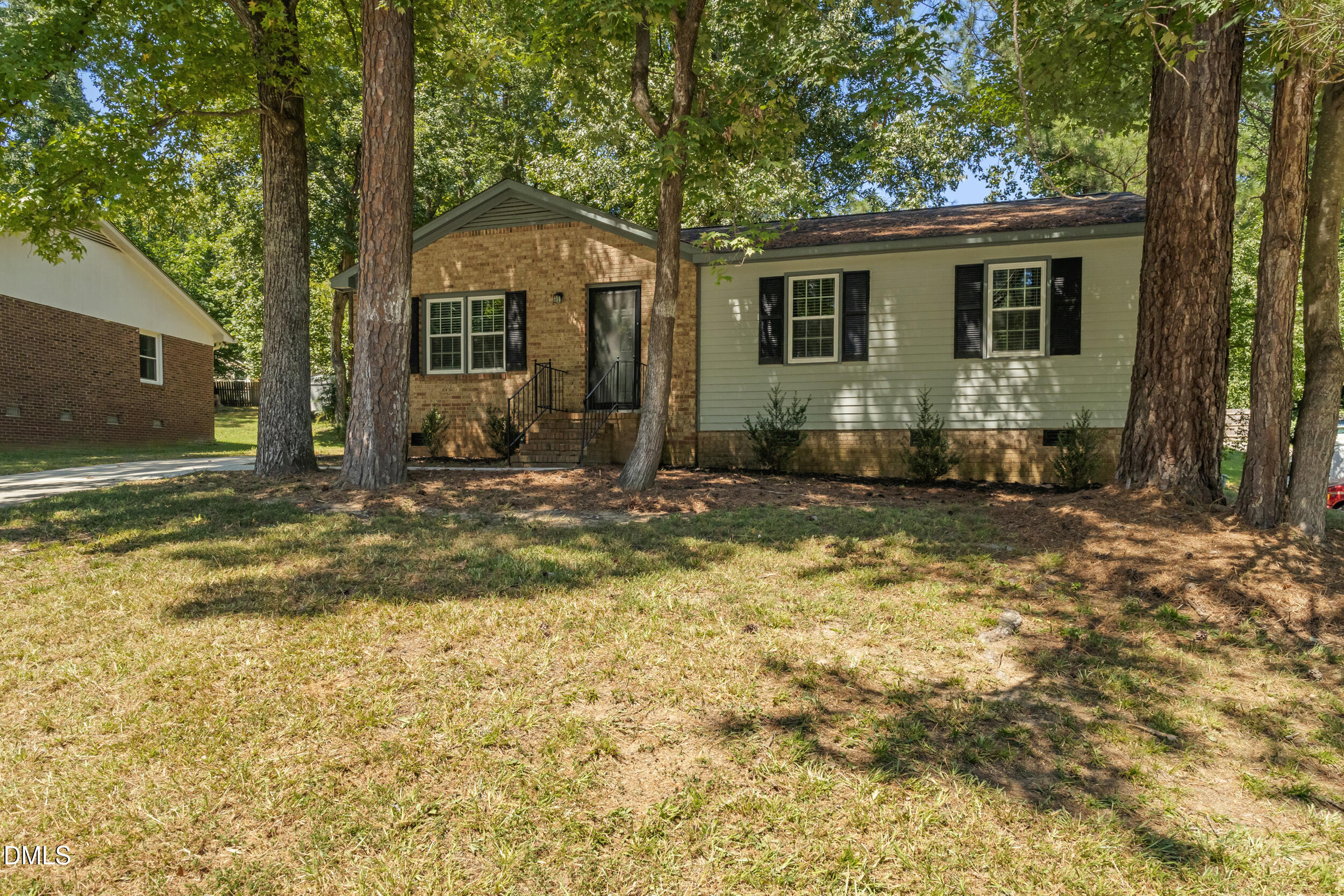 2400 Keith Drive Raleigh, NC 27610 - Photo 3 of 35 a front view of a house with a yard