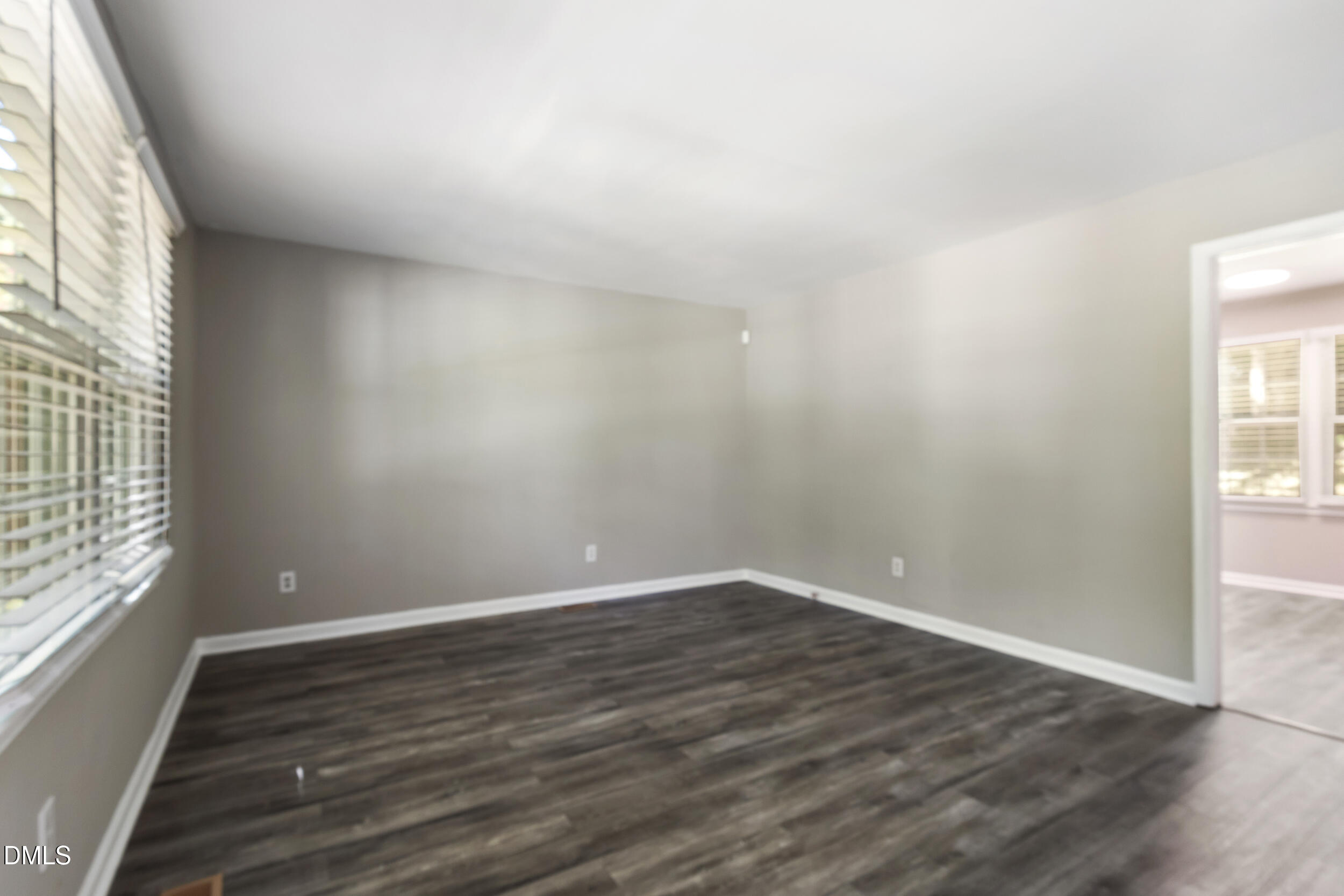 2400 Keith Drive Raleigh, NC 27610 - Photo 7 of 35 wooden floor in an empty room with a window