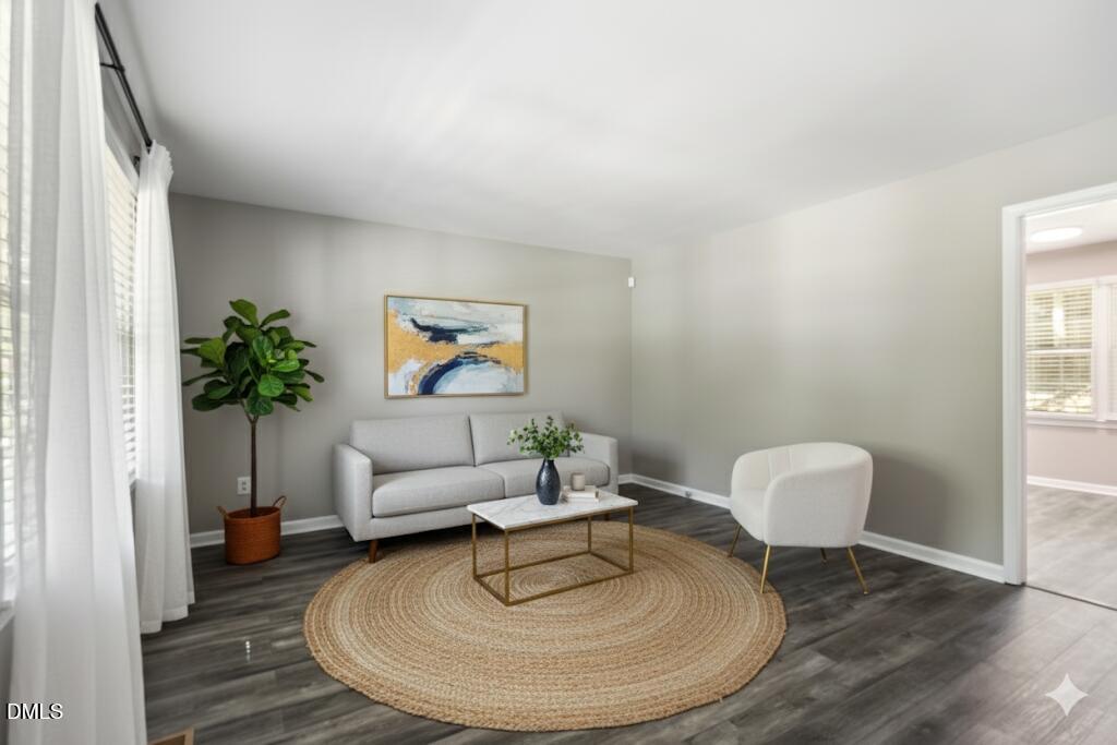 2400 Keith Drive Raleigh, NC 27610 - Photo 8 of 35 a living room with furniture and a potted plant