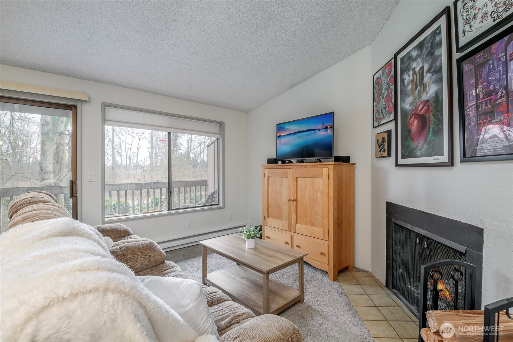 8521 South 259th Street, Unit B15 Kent, WA 98030 - Photo 3 of 24 a living room with furniture and a fireplace