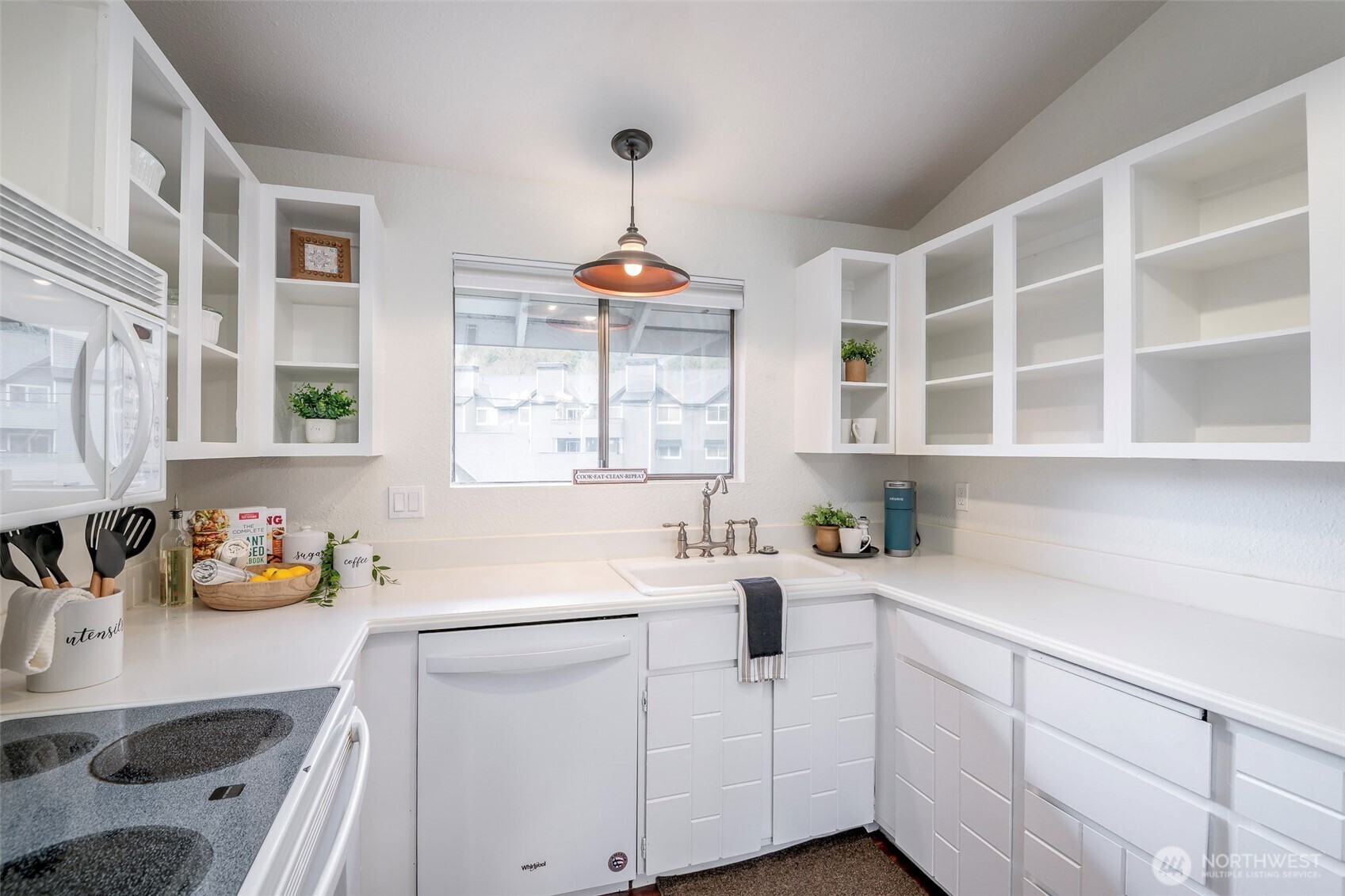 8521 South 259th Street, Unit B15 Kent, WA 98030 - Photo 10 of 24 a kitchen with a sink a window and cabinets