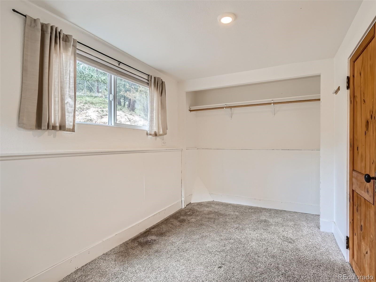 11799 Ranch Elsie Road Golden, CO 80403 - Photo 14 of 28 a view of a room that has a window
