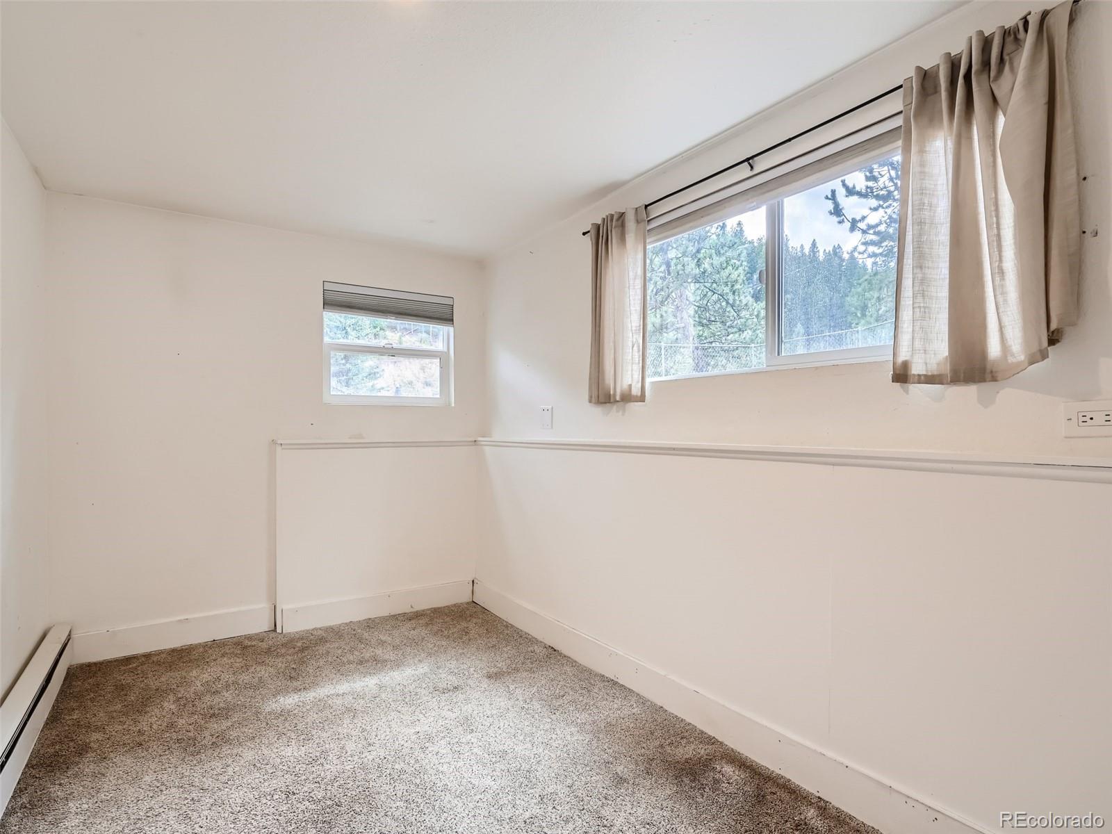 11799 Ranch Elsie Road Golden, CO 80403 - Photo 15 of 28 a view of a window in an empty room