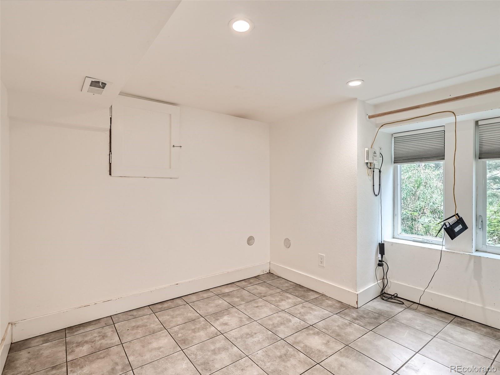 11799 Ranch Elsie Road Golden, CO 80403 - Photo 22 of 28 a view of an empty room and window
