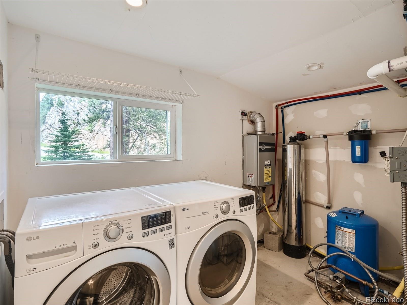 11799 Ranch Elsie Road Golden, CO 80403 - Photo 24 of 28 a view of livingroom with washer and dryer