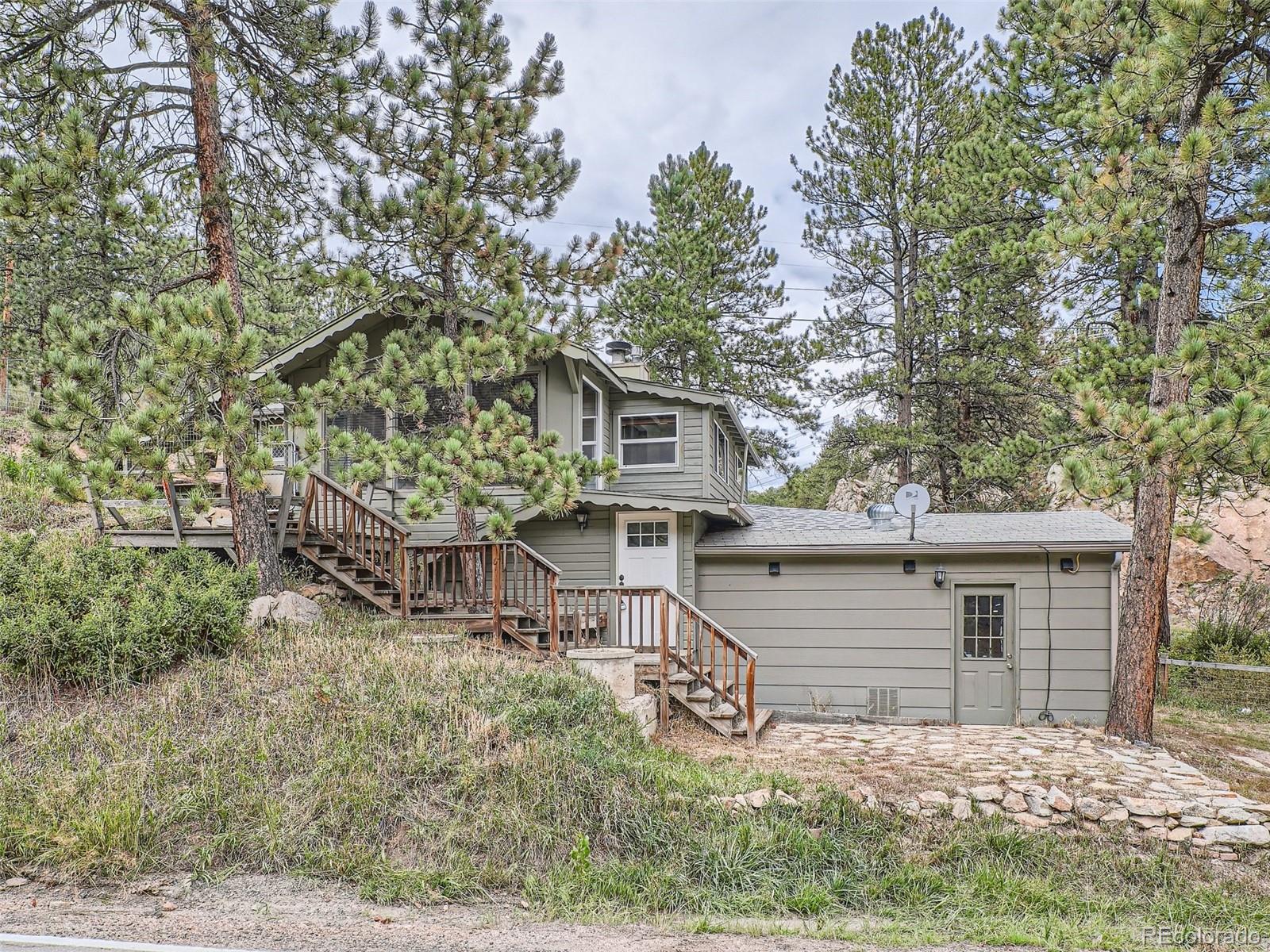 11799 Ranch Elsie Road Golden, CO 80403 - Photo 3 of 28 front view of house with a yard