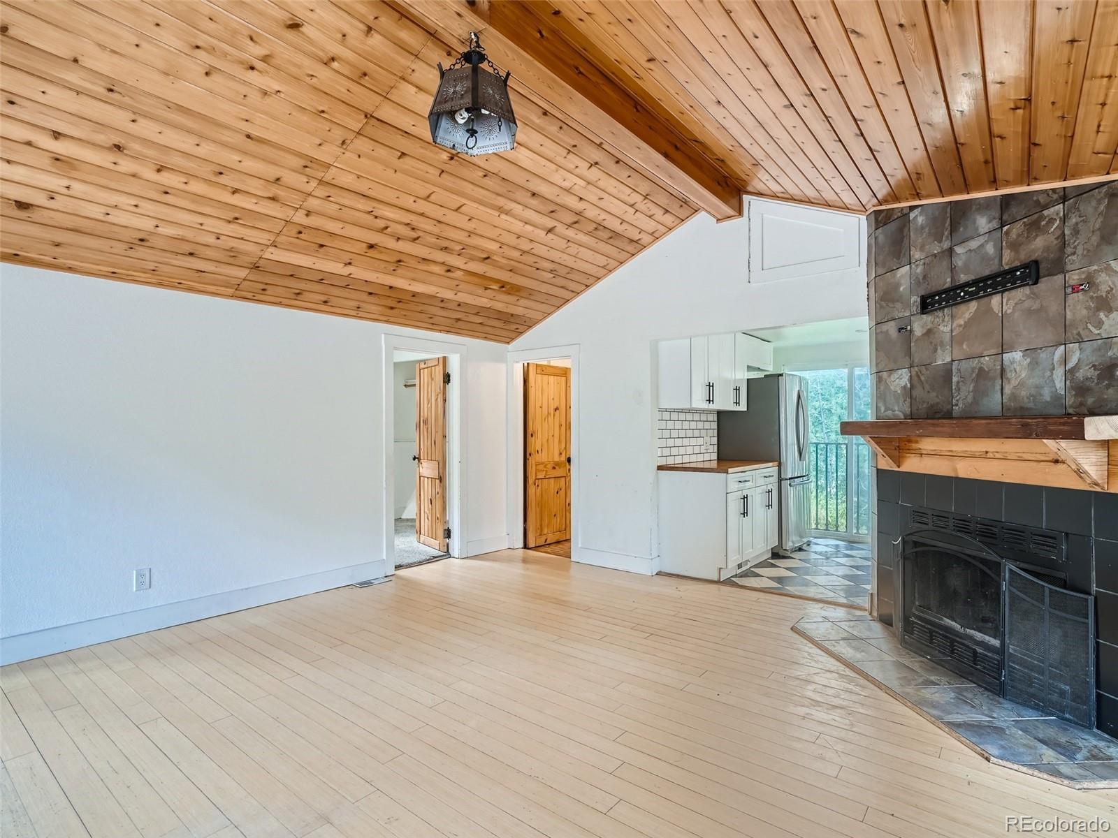 11799 Ranch Elsie Road Golden, CO 80403 - Photo 6 of 28 a view of a livingroom with a fireplace