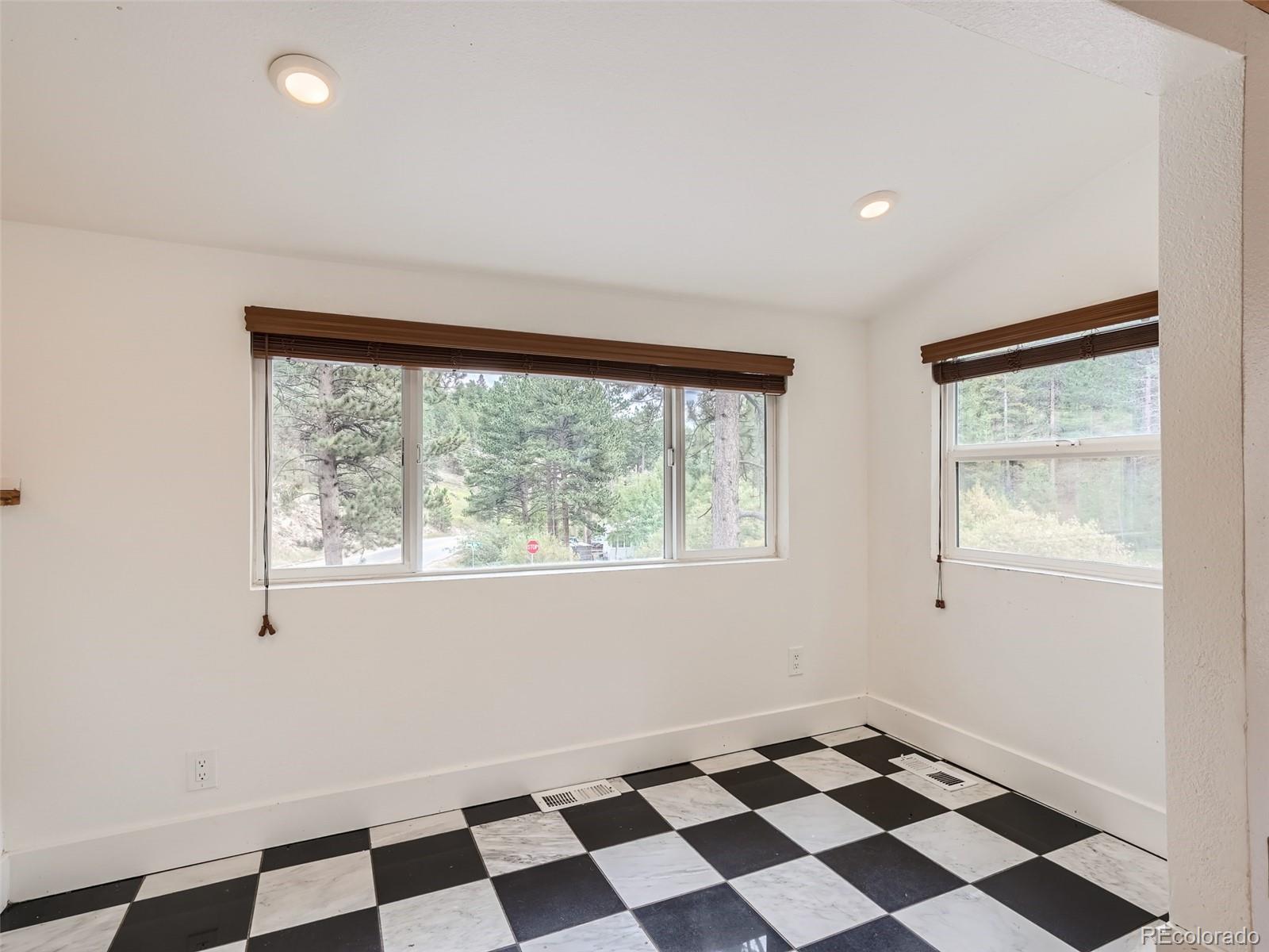 11799 Ranch Elsie Road Golden, CO 80403 - Photo 9 of 28 a black and white checkered floor with a black white checkered floor