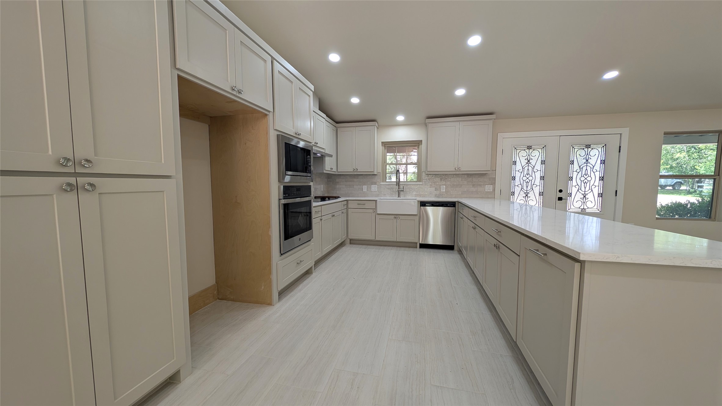 11811 Sleepy Hollow Road Manchaca, TX 78652 - Photo 8 of 31 a kitchen with a refrigerator and a sink