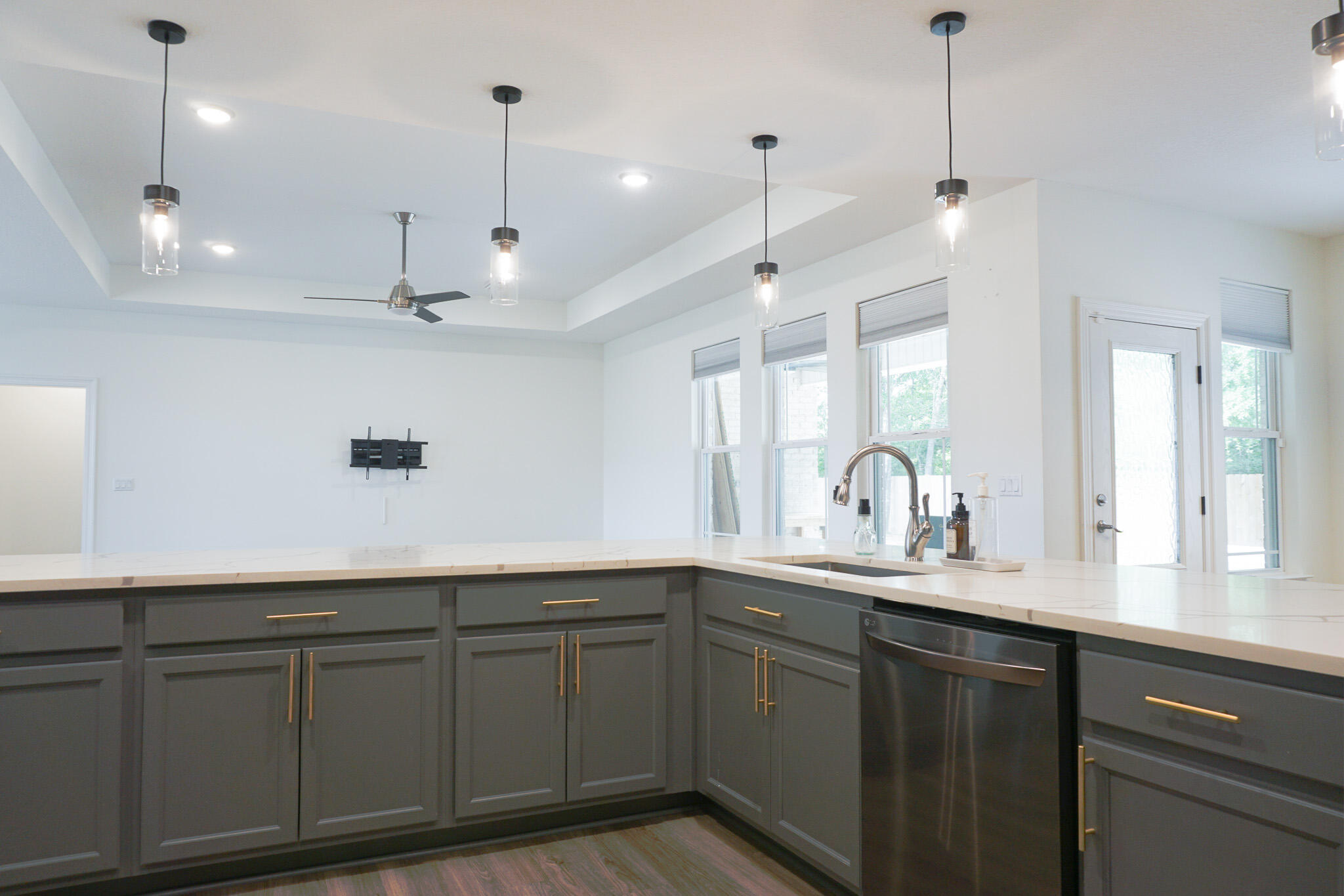 5464 Jenee Court Crestview, FL 32539 - Photo 16 of 63 a kitchen with kitchen island white cabinets and white appliances