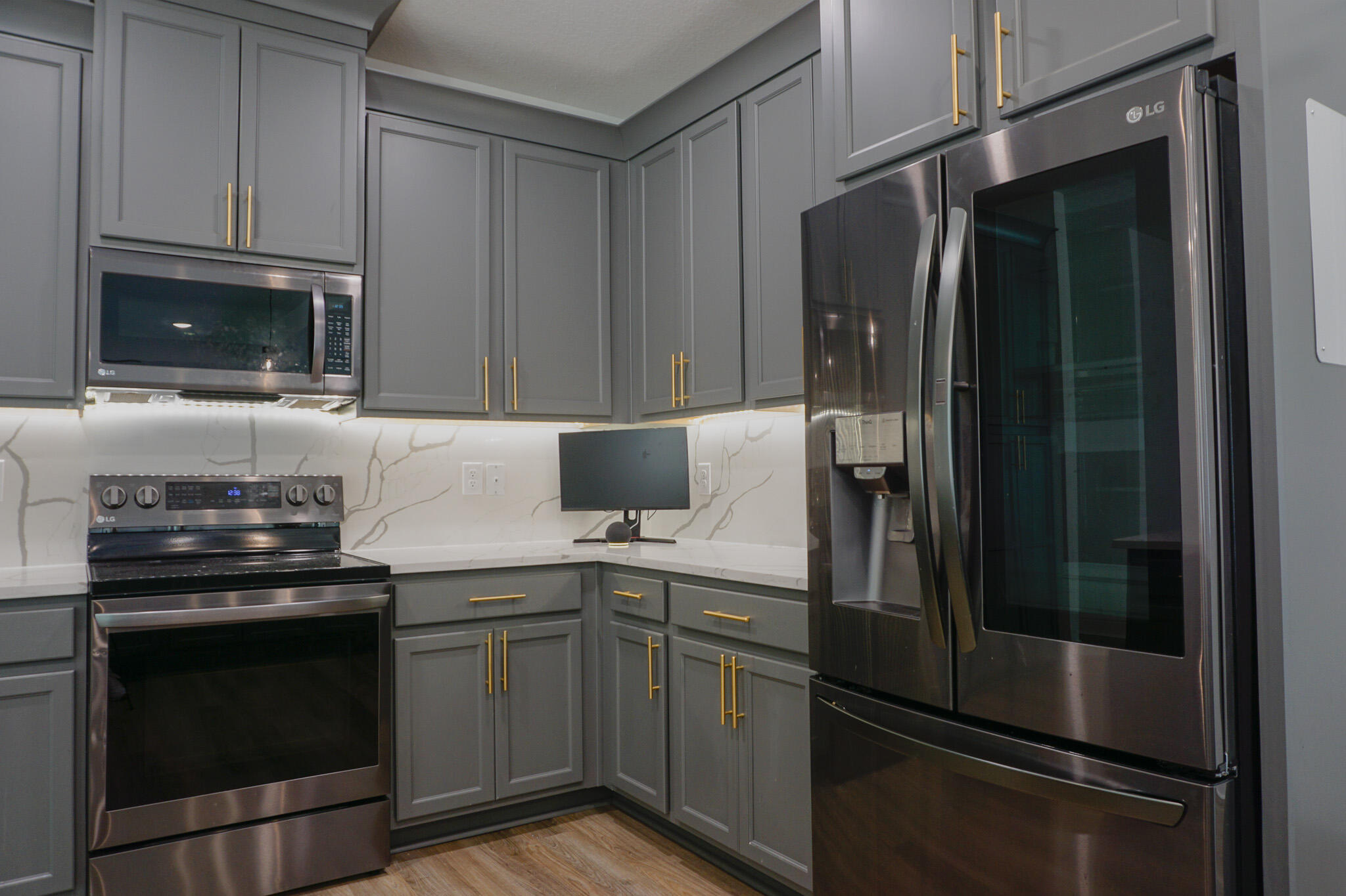 5464 Jenee Court Crestview, FL 32539 - Photo 17 of 63 a kitchen with a refrigerator stove and microwave