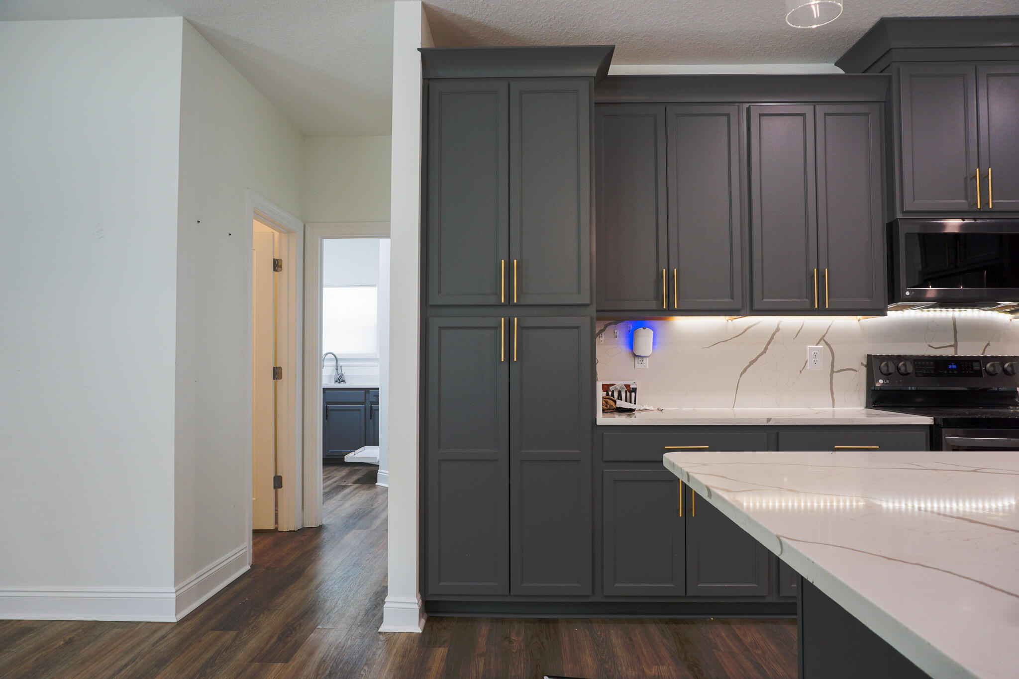 5464 Jenee Court Crestview, FL 32539 - Photo 18 of 63 a kitchen with a sink and a refrigerator