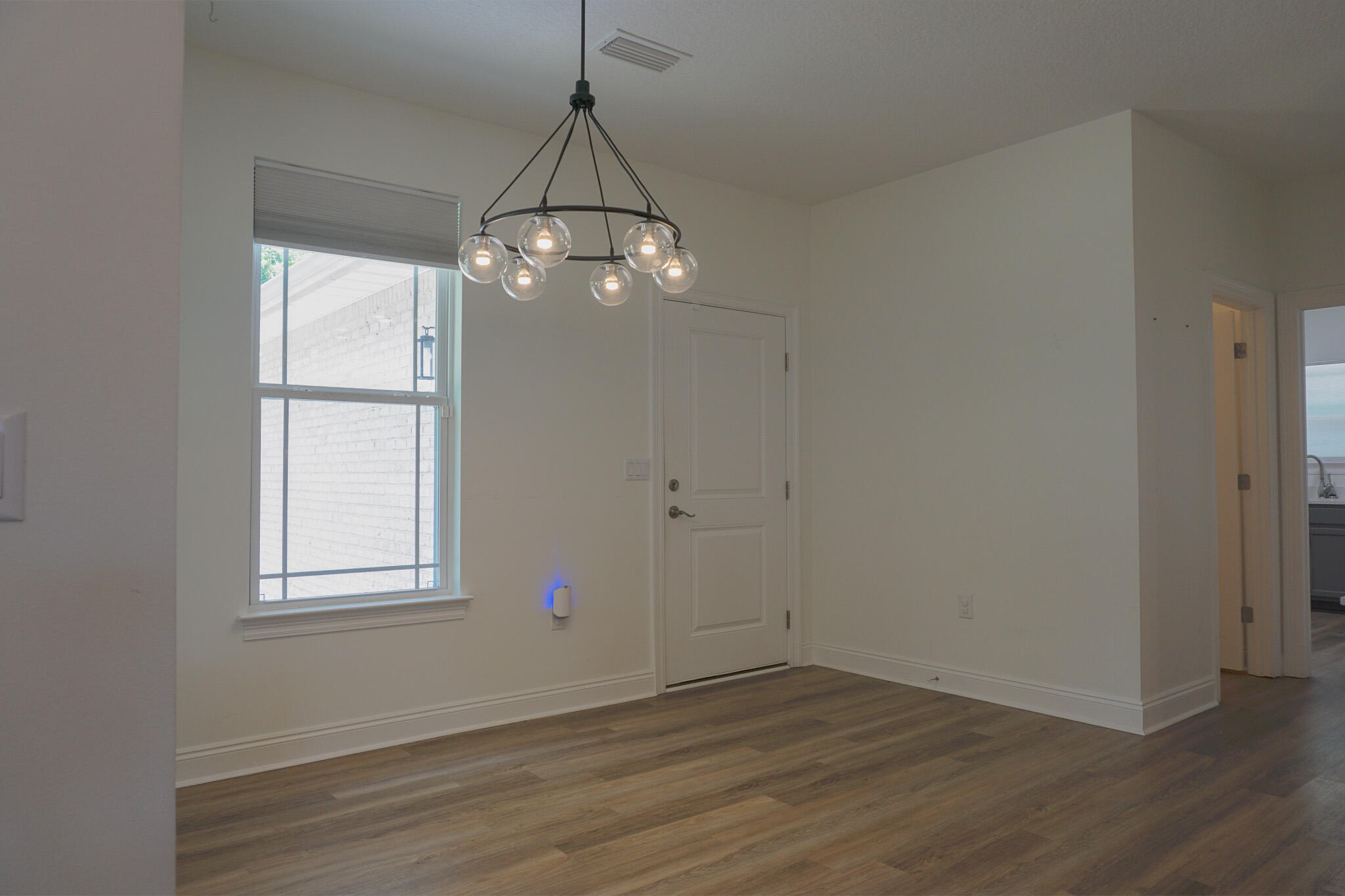 5464 Jenee Court Crestview, FL 32539 - Photo 19 of 63 an empty room with wooden floor and windows
