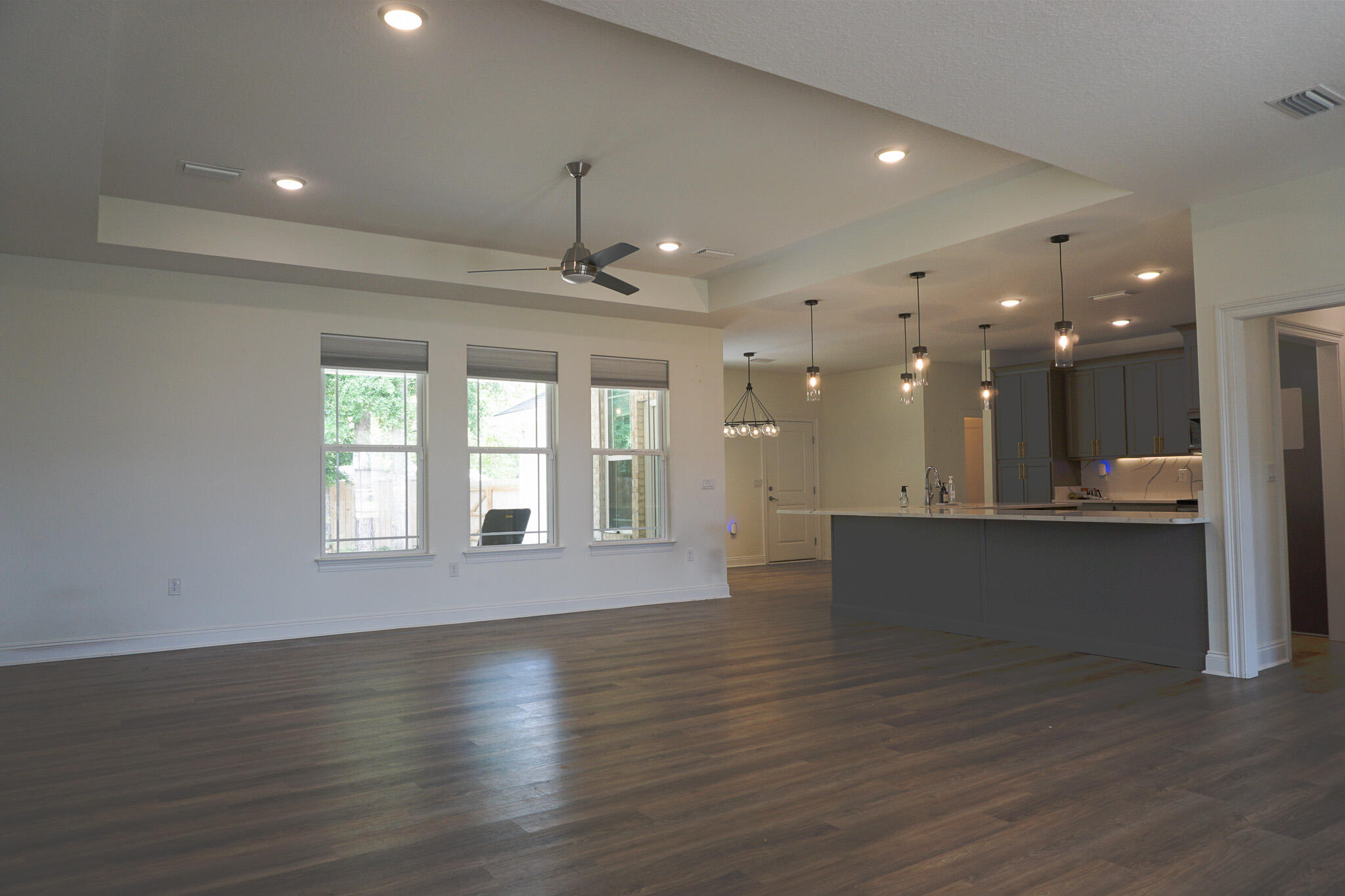 5464 Jenee Court Crestview, FL 32539 - Photo 21 of 63 a view of an empty room with wooden floor and a window