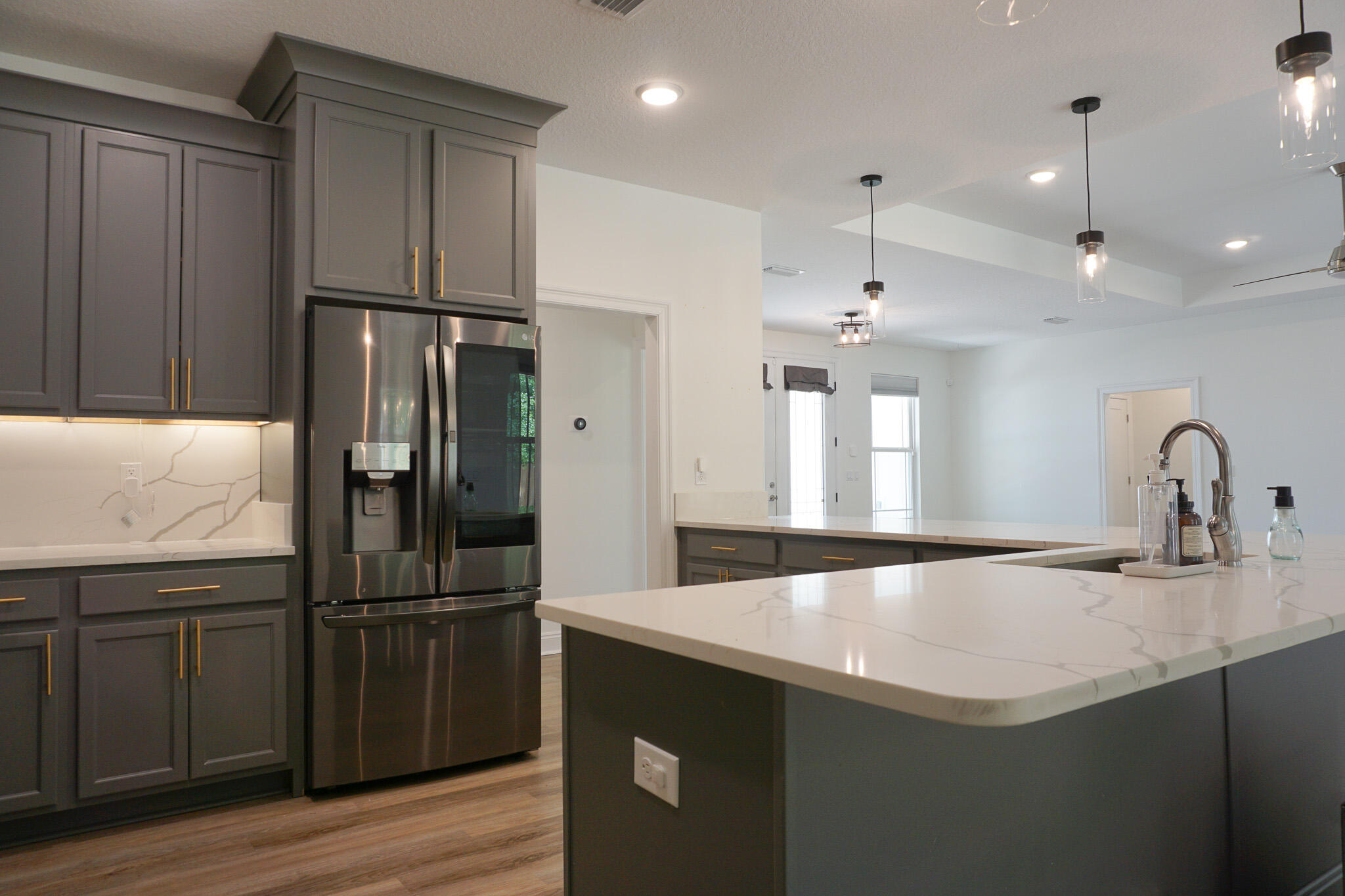 5464 Jenee Court Crestview, FL 32539 - Photo 22 of 63 a kitchen with granite countertop a refrigerator and a sink