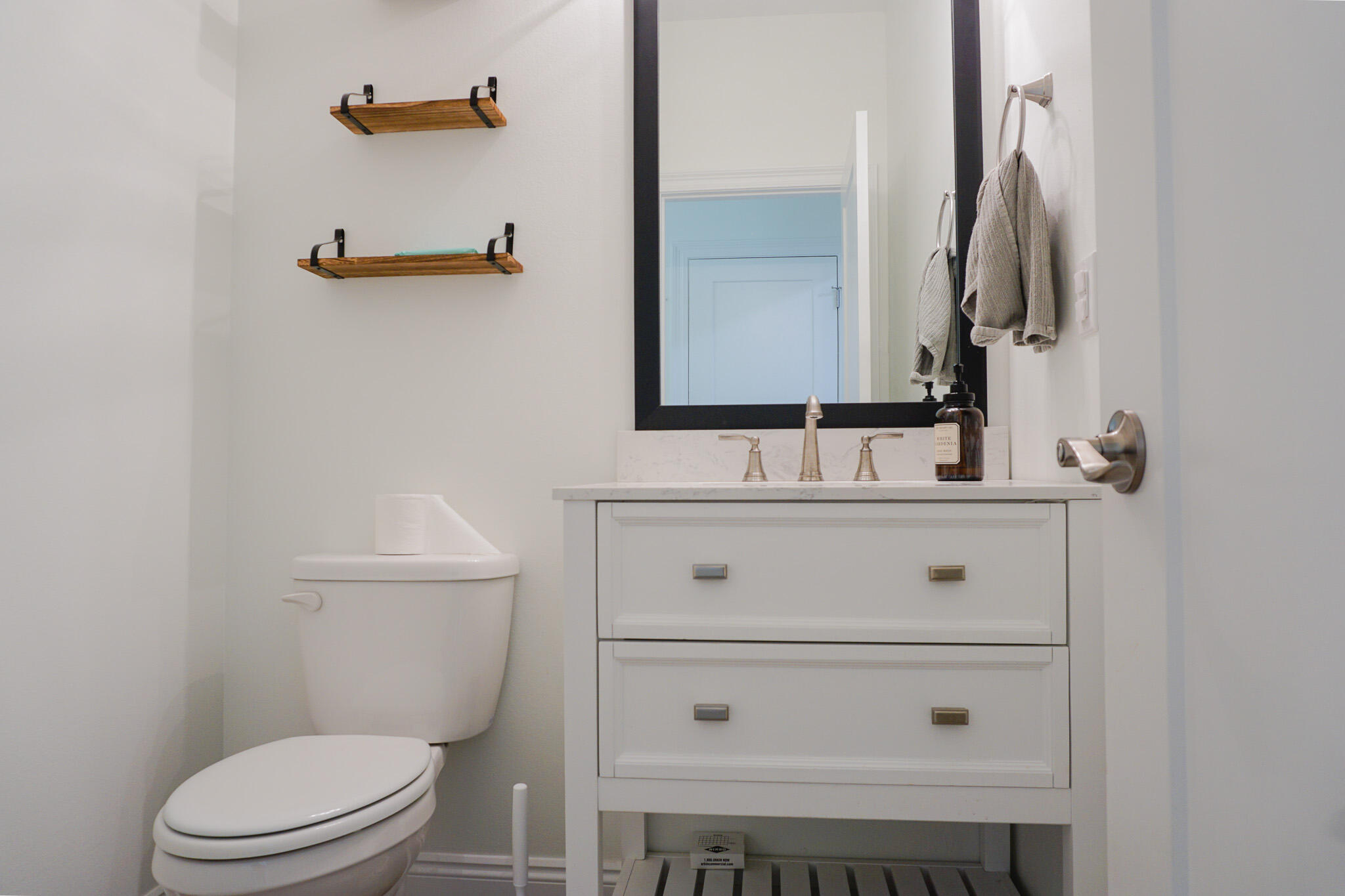 5464 Jenee Court Crestview, FL 32539 - Photo 24 of 63 a bathroom with a toilet sink and mirror