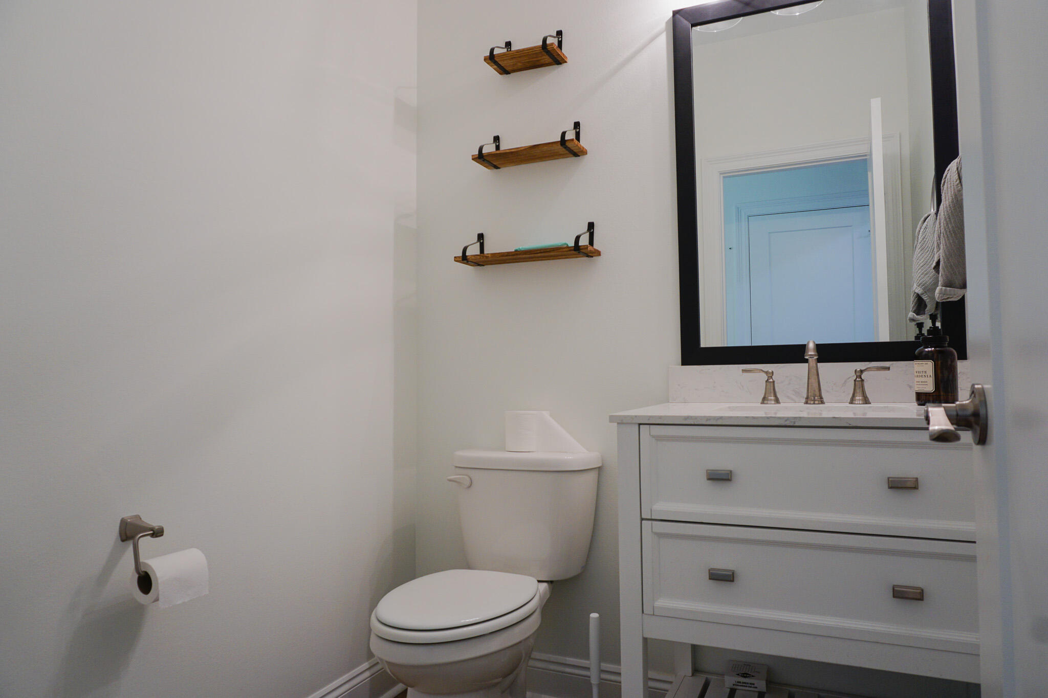 5464 Jenee Court Crestview, FL 32539 - Photo 25 of 63 a bathroom with a sink a toilet and mirror