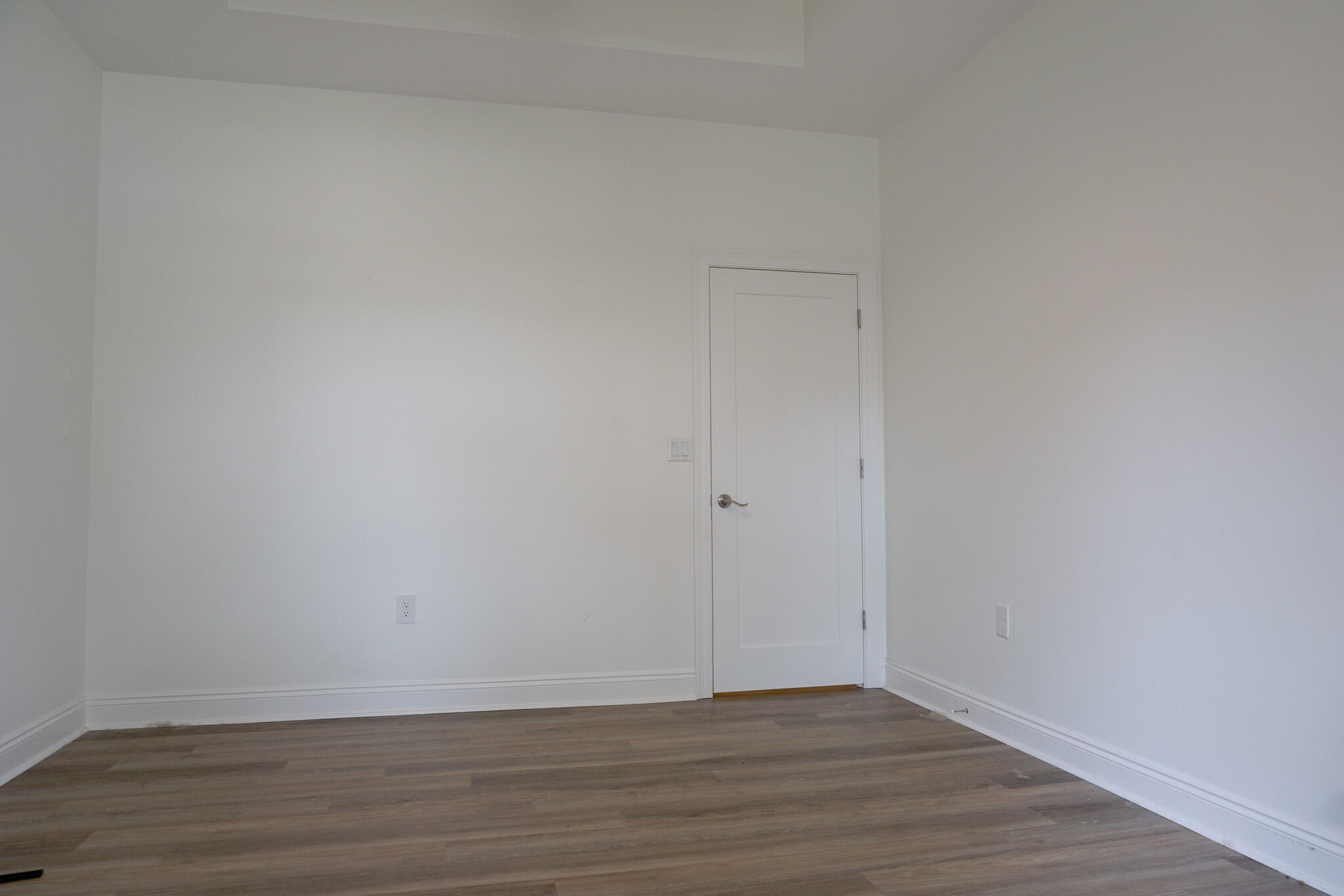 5464 Jenee Court Crestview, FL 32539 - Photo 30 of 63 a view of an empty room with wooden floor