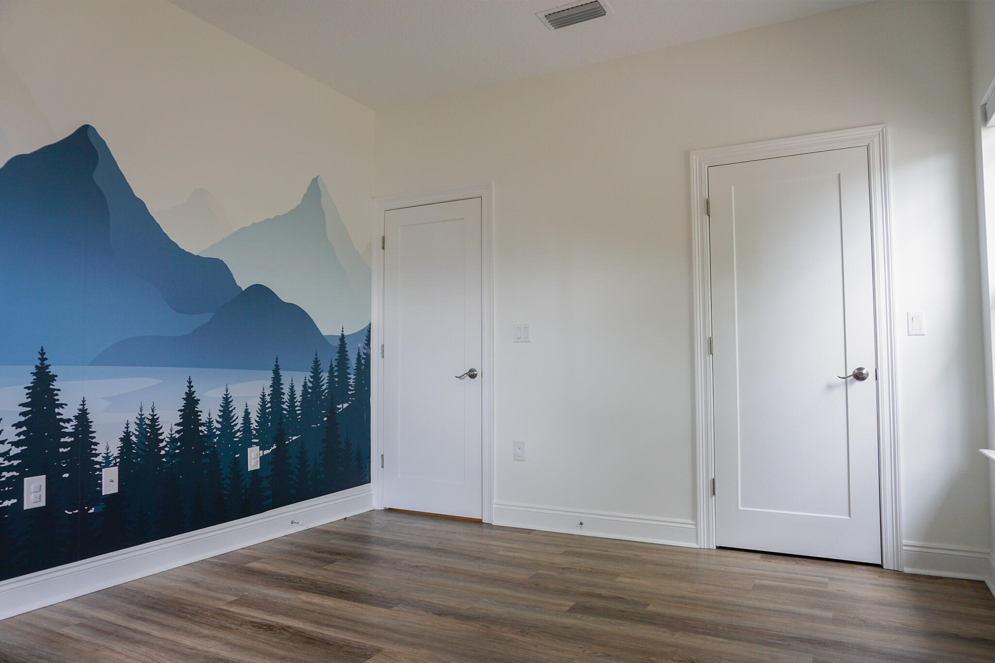 5464 Jenee Court Crestview, FL 32539 - Photo 34 of 63 a view of a hallway with entryway and wooden floor