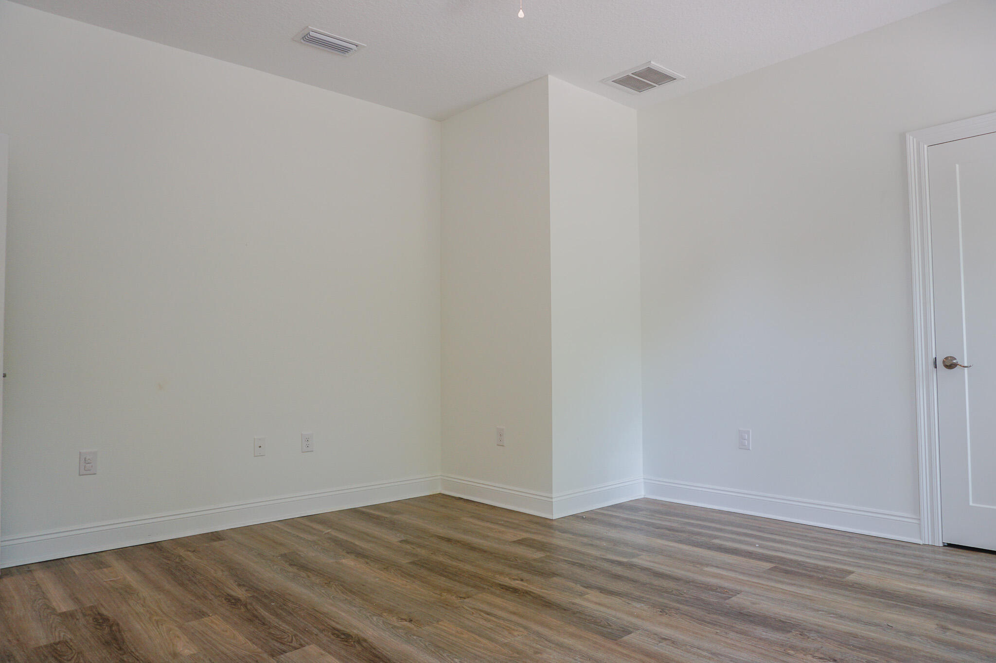 5464 Jenee Court Crestview, FL 32539 - Photo 37 of 63 a view of an empty room with wooden floor and closet