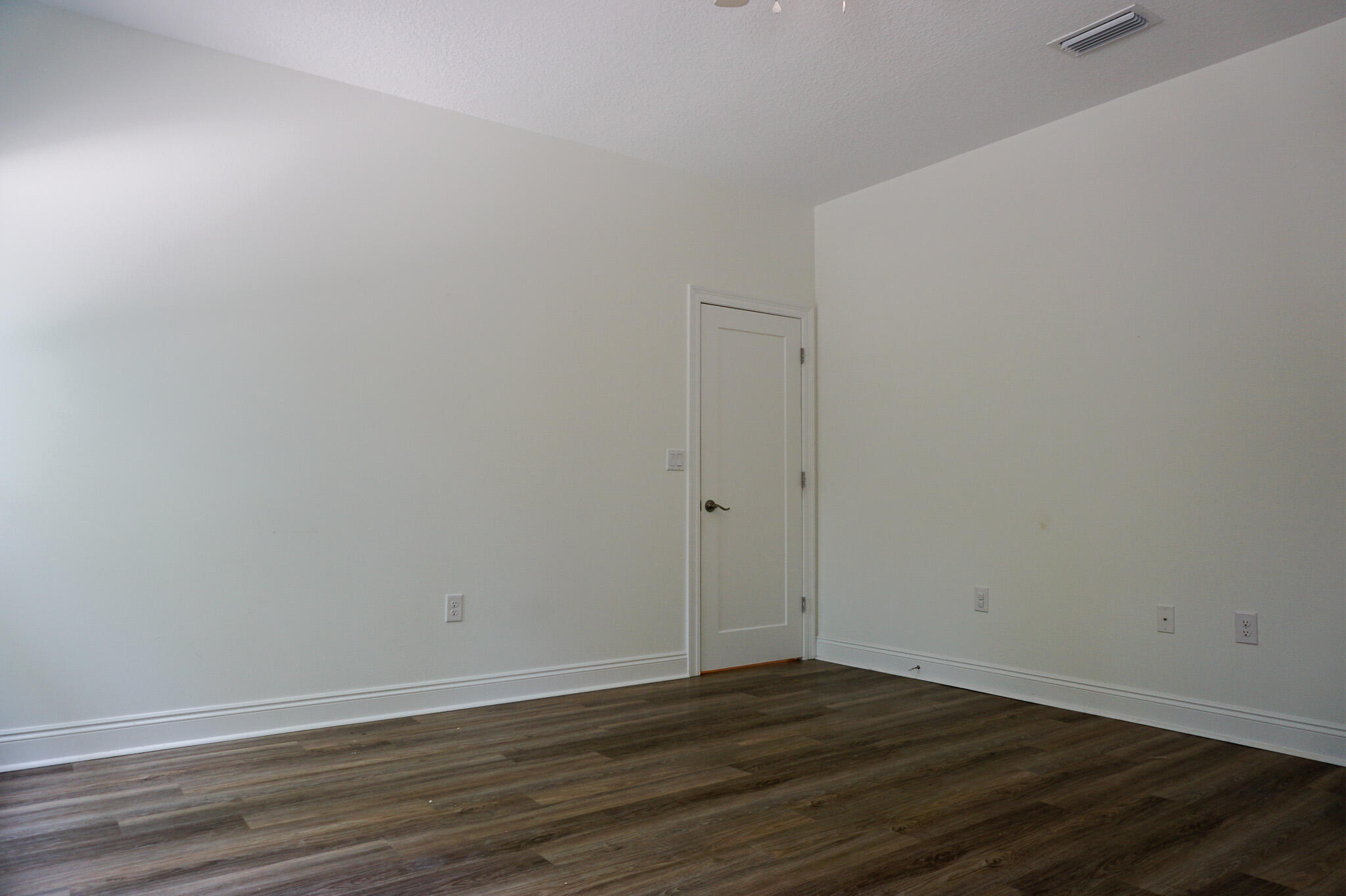 5464 Jenee Court Crestview, FL 32539 - Photo 39 of 63 a view of an empty room with wooden floor