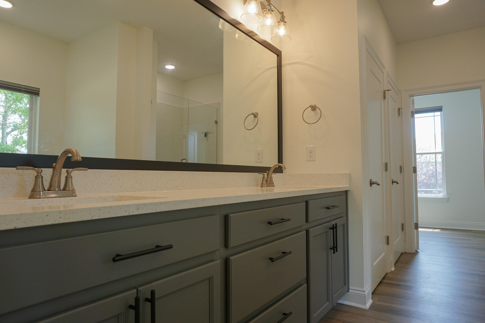 5464 Jenee Court Crestview, FL 32539 - Photo 44 of 63 a bathroom with a double vanity sink and mirror