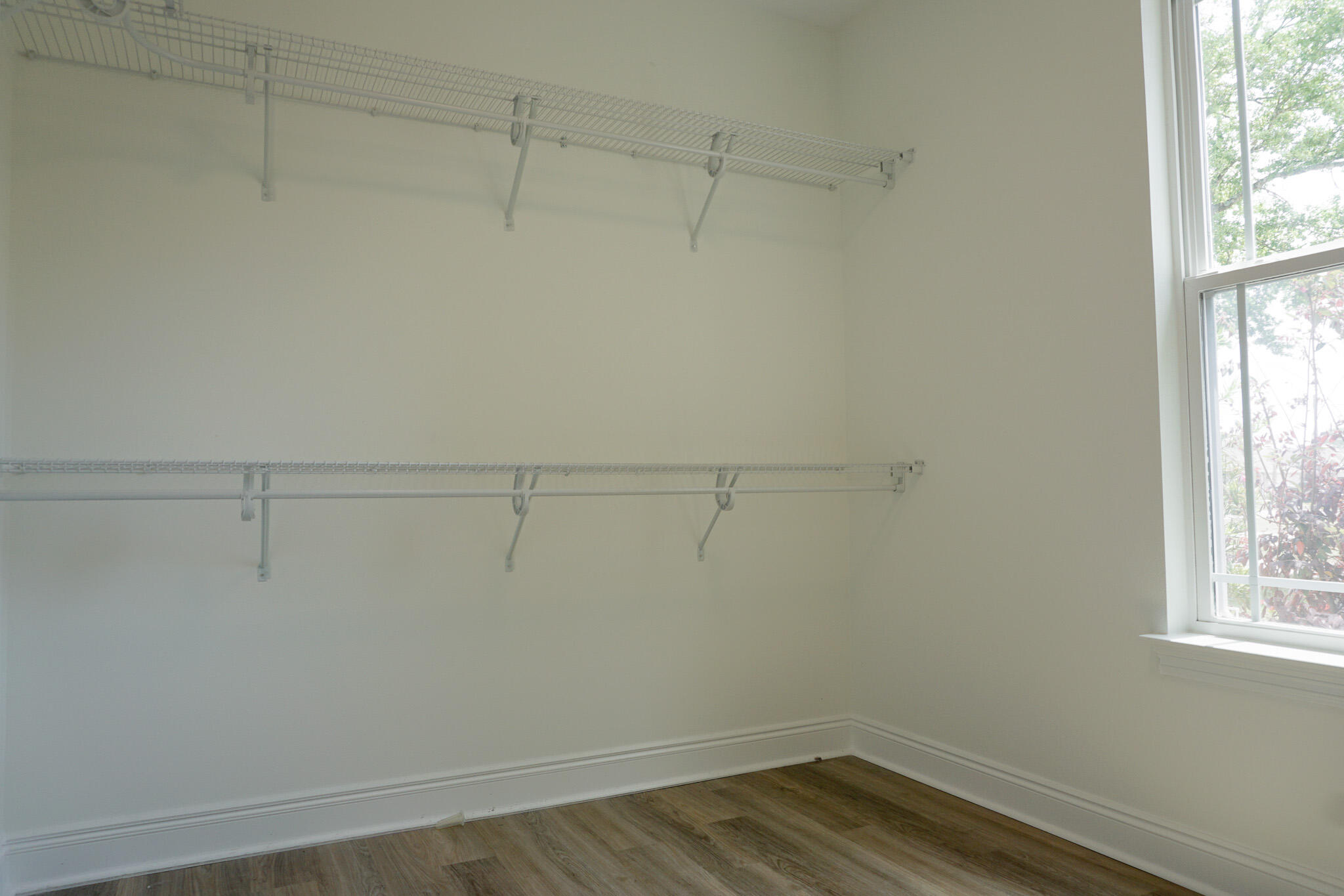 5464 Jenee Court Crestview, FL 32539 - Photo 52 of 63 a view of a room with racks on the wall