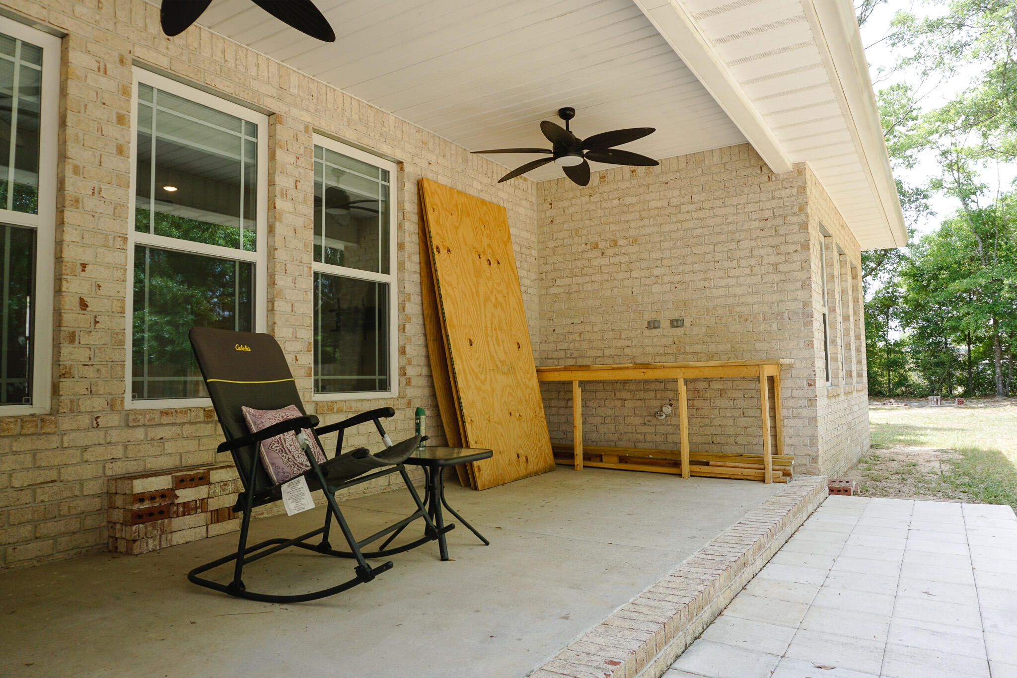 5464 Jenee Court Crestview, FL 32539 - Photo 58 of 63 a view of a porch with a table and chairs