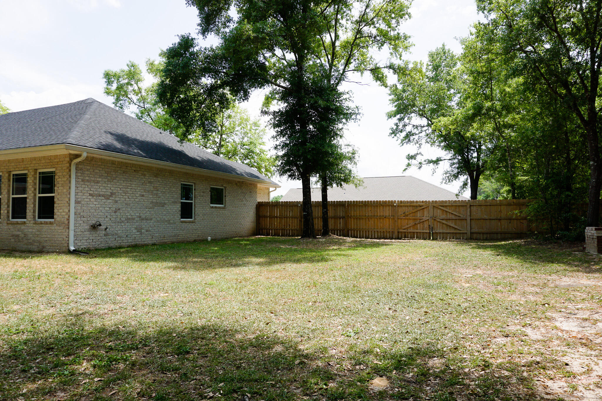 5464 Jenee Court Crestview, FL 32539 - Photo 63 of 63 a backyard of a house with lots of green space
