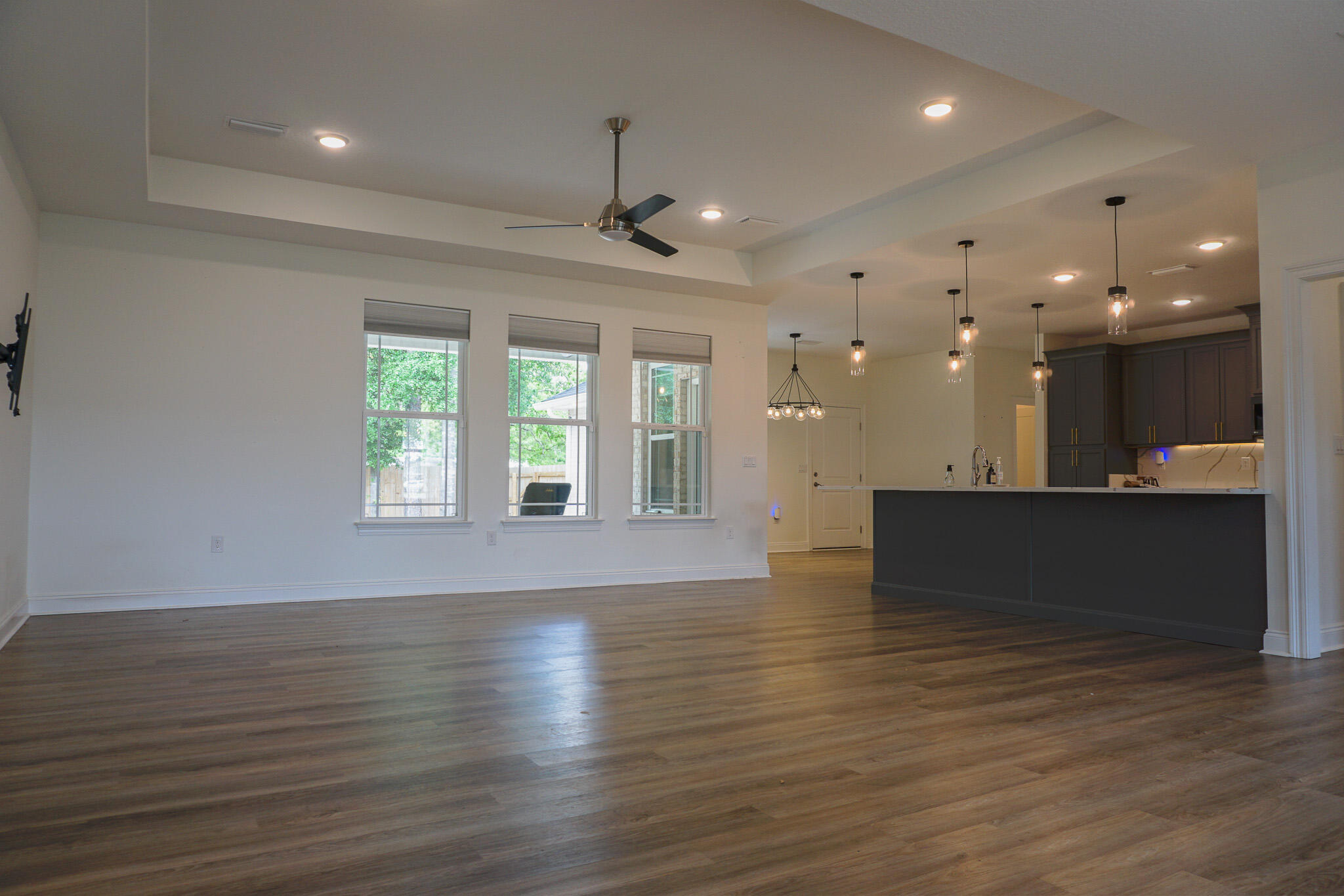 5464 Jenee Court Crestview, FL 32539 - Photo 7 of 63 an empty room with wooden floor and windows