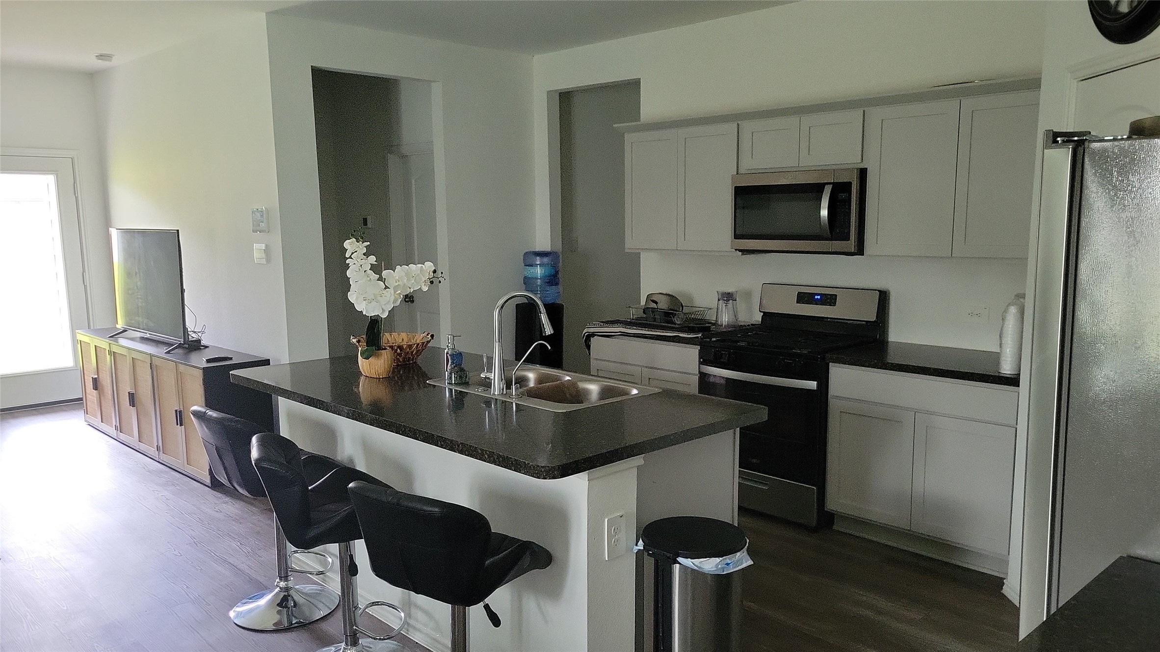 24443 Springfield Valley Drive Spring, TX 77373 - Photo 5 of 10 a kitchen with stainless steel appliances a sink and a refrigerator