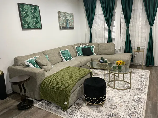 a living room with furniture and a rug