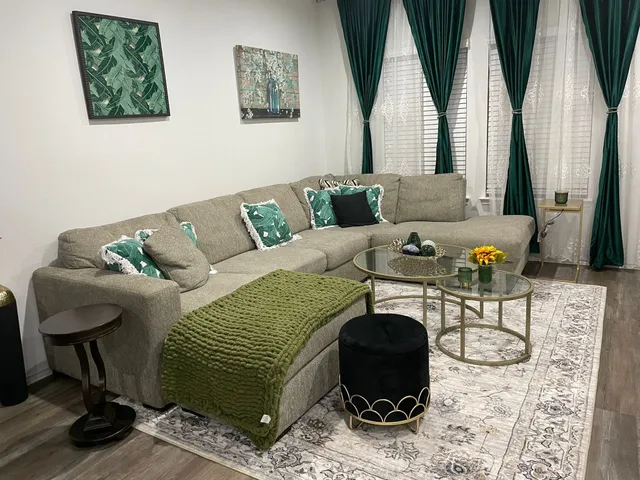 a living room with furniture and a rug