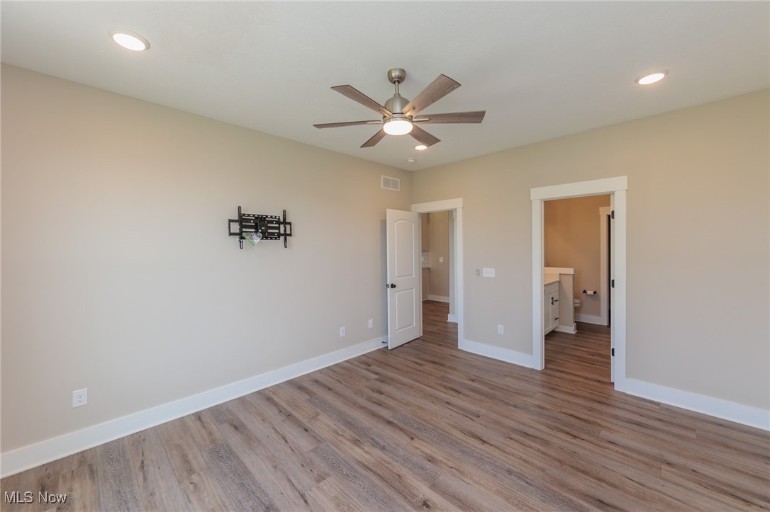 36458 Appian Way North Ridgeville, OH 44039 - Photo 17 of 37 Unfurnished room featuring ceiling fan and wood-type flooring