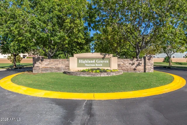 a view of a swimming pool with a yard
