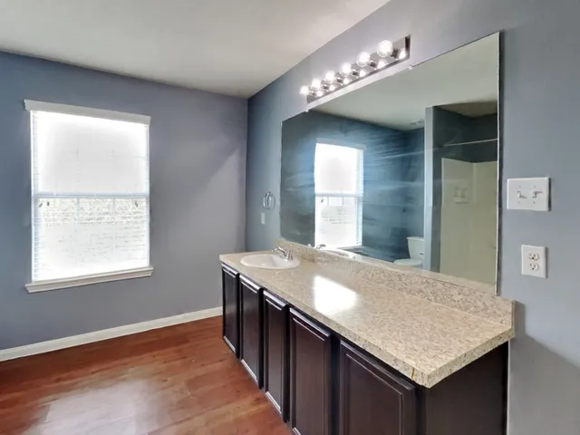 a bathroom with a bathtub and a sink