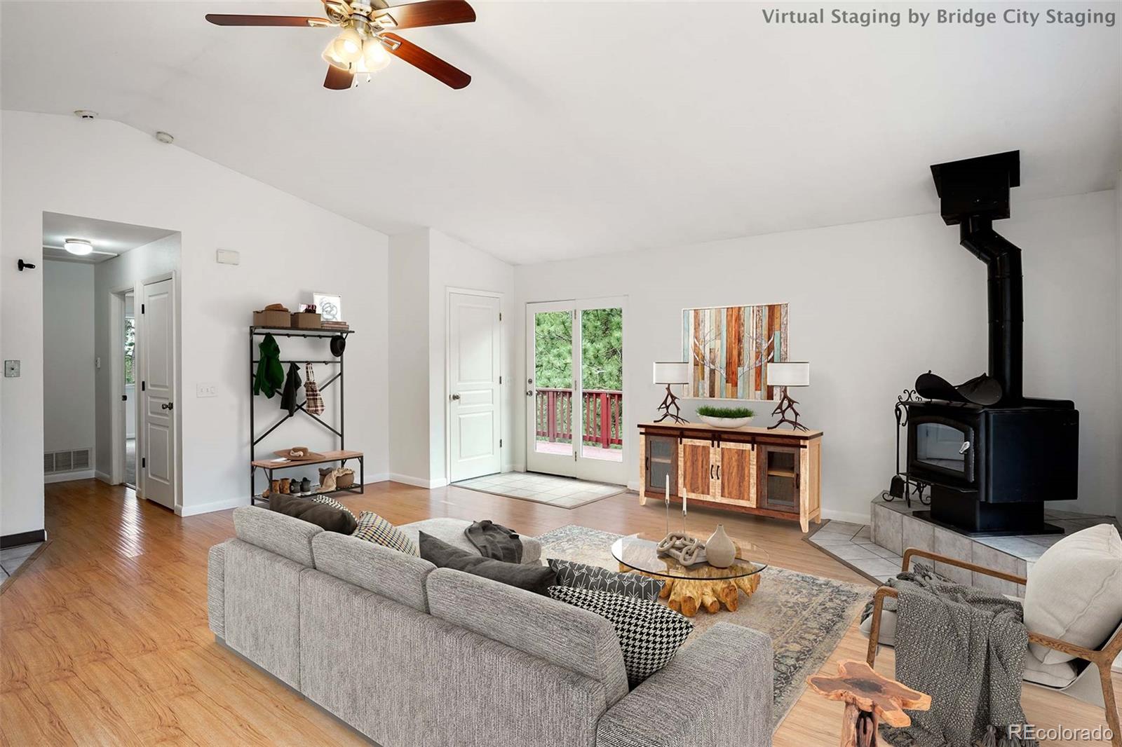 13519 Elsie Road Conifer, CO 80433 - Photo 11 of 31 a living room with furniture and a wooden floor