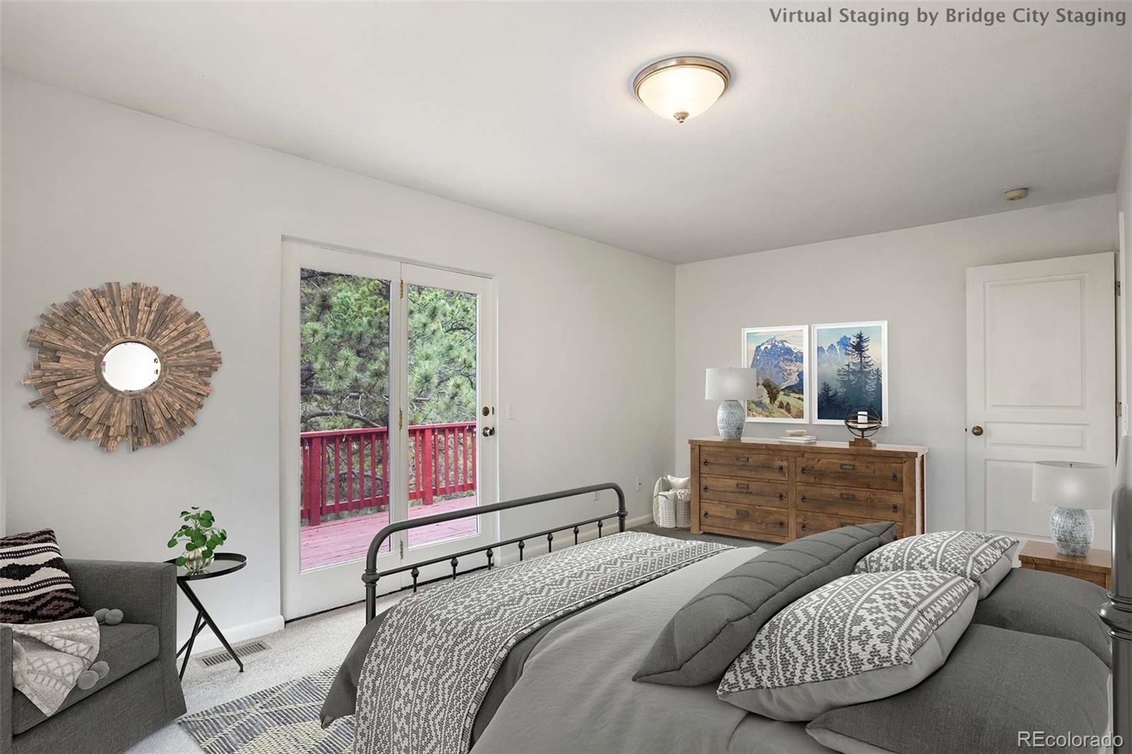 13519 Elsie Road Conifer, CO 80433 - Photo 14 of 31 a bedroom with a bed and wooden floor