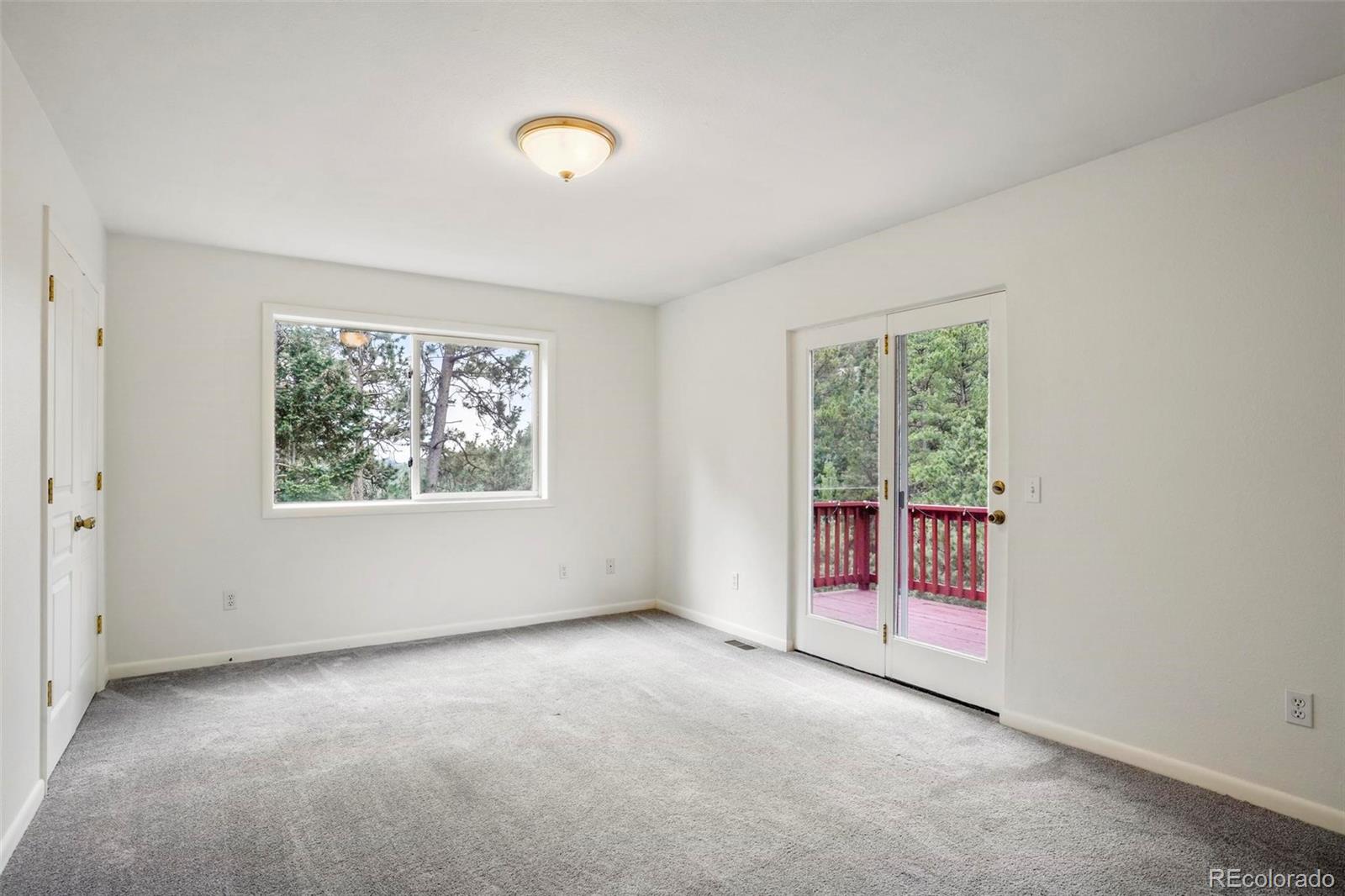 13519 Elsie Road Conifer, CO 80433 - Photo 15 of 31 an empty room with windows