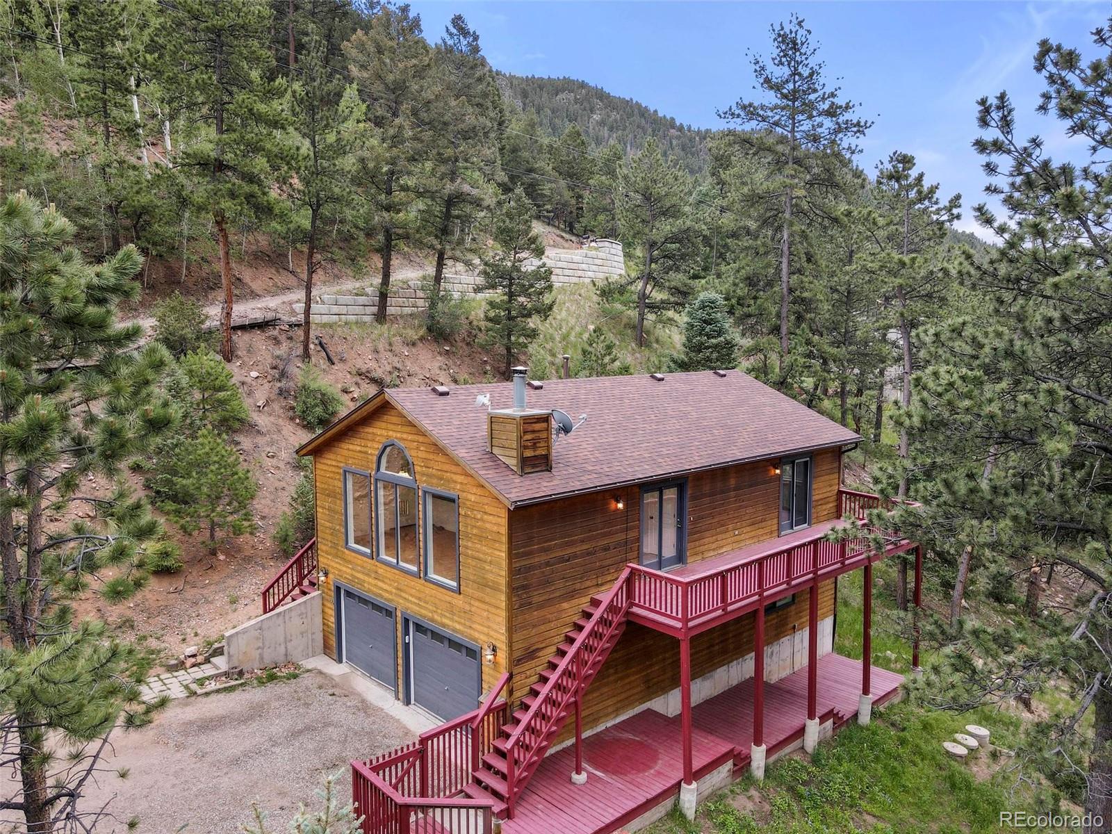13519 Elsie Road Conifer, CO 80433 - Photo 2 of 31 a aerial view of a house with a balcony