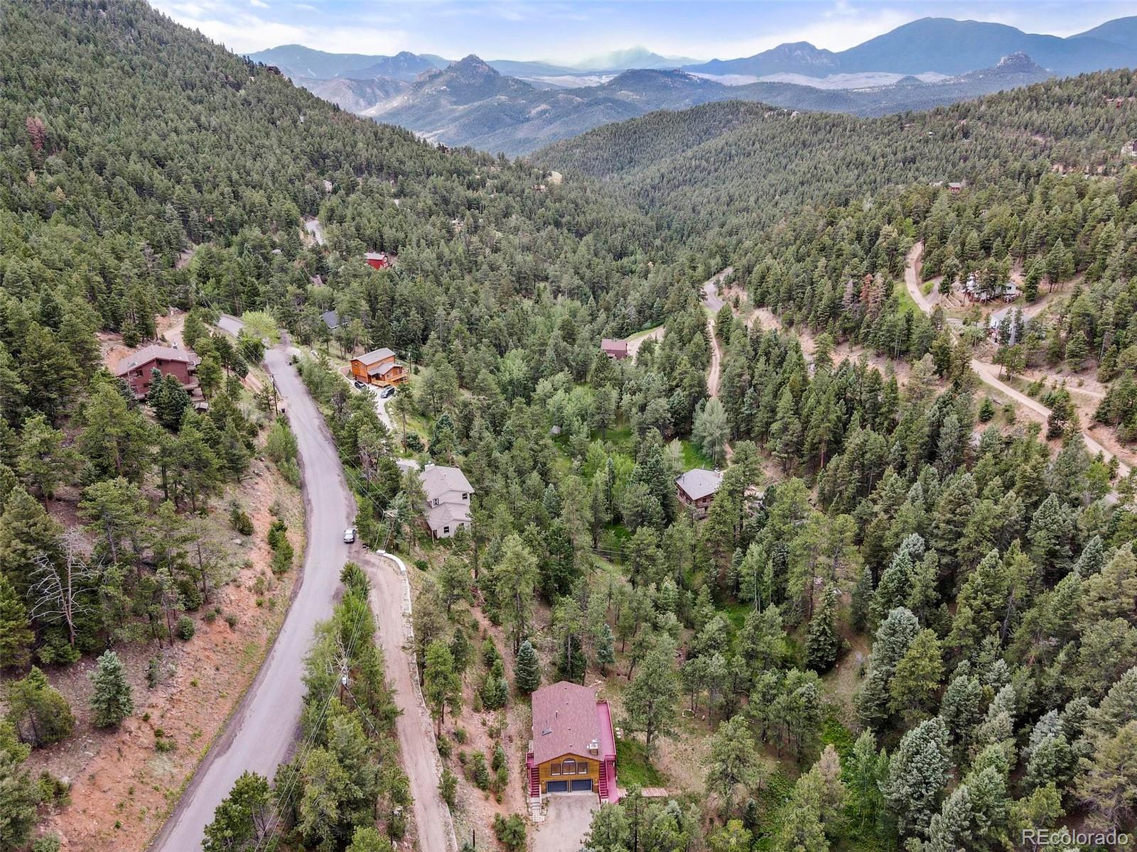 13519 Elsie Road Conifer, CO 80433 - Photo 26 of 31 a view of a city with a mountain